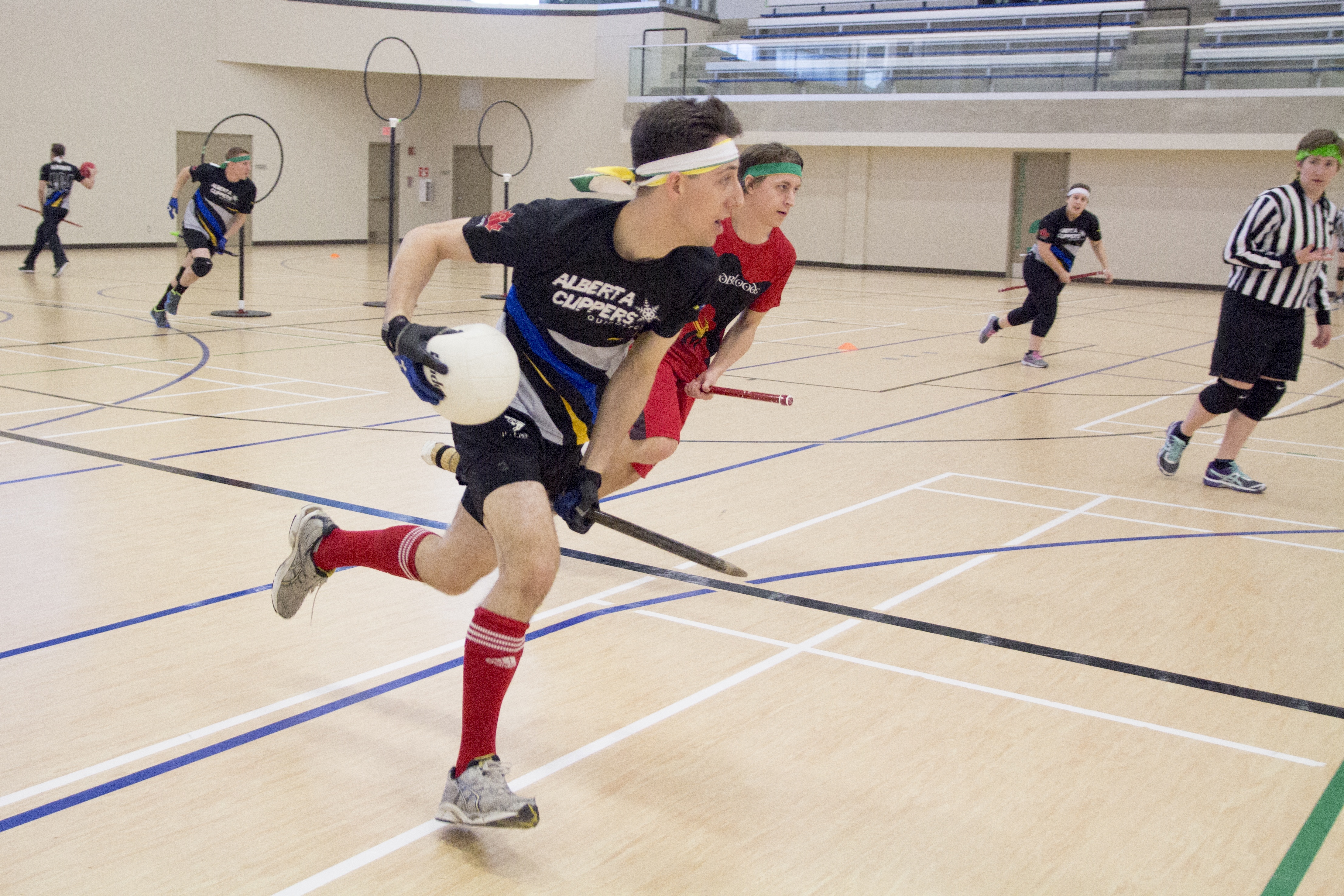 UNIQUE FUN – Chris Radojewski of the Alberta Clippers Quidditch team races with the ‘quaffle’ and seeks to pass while opponent James Newman of the Calgary Mudbloods looks ahead to cut off Radojewski.