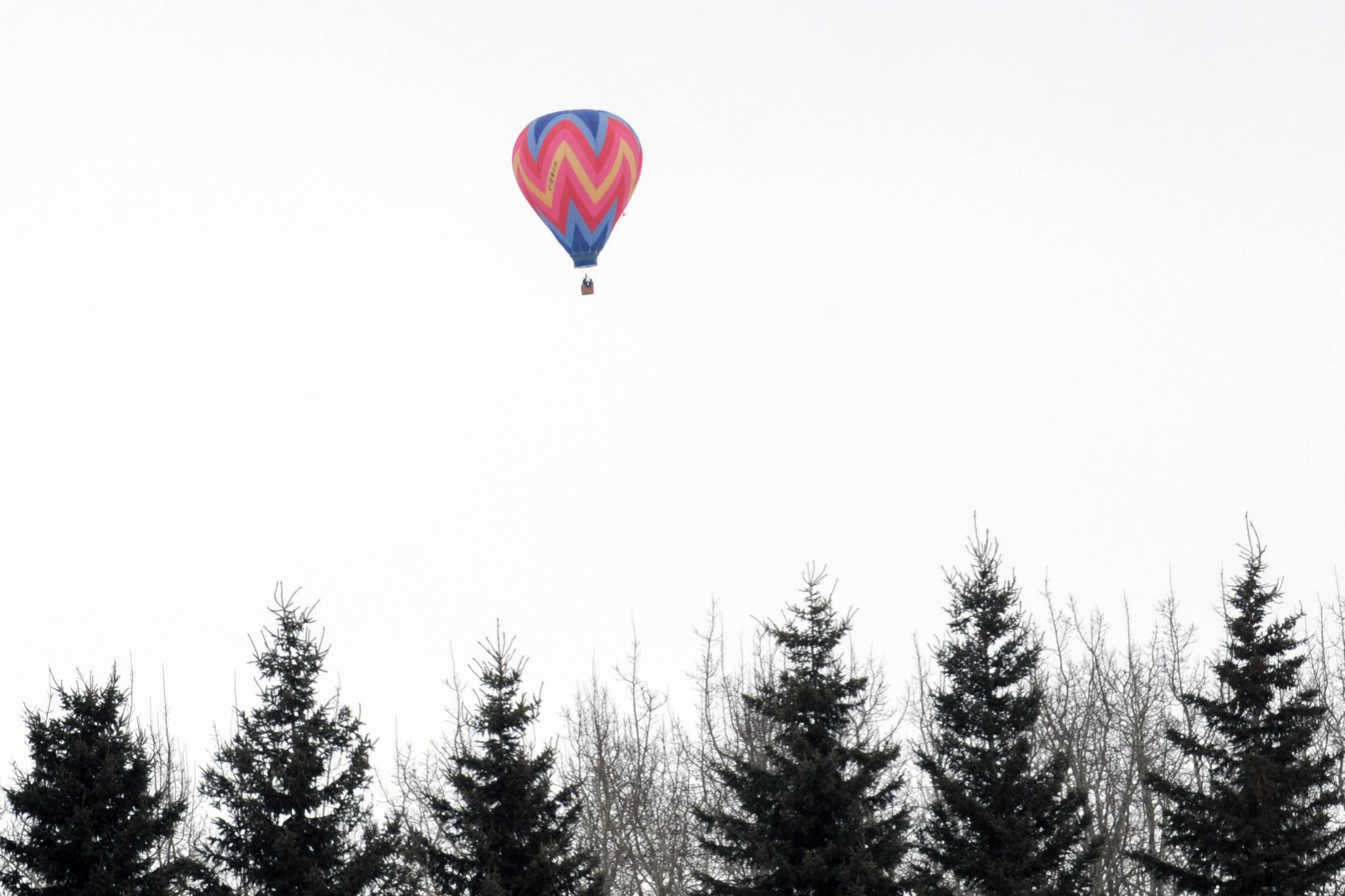 SLOWLY- Hot air balloons filled the sky just west of the City recently as they floated one by one.