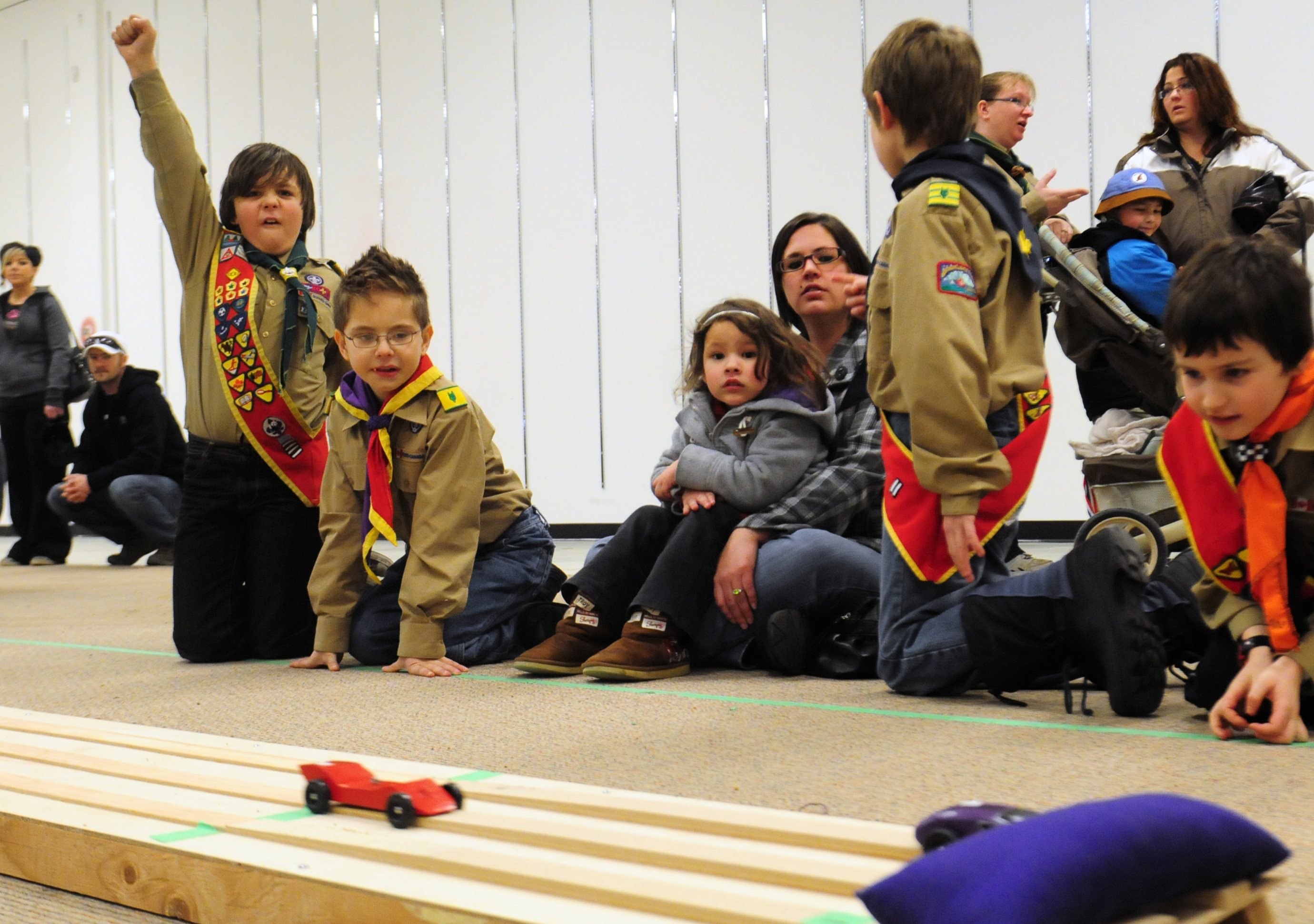 CHEER ON-The Waskasoo Area 2011 Kub Kar Rally was bigger and better this past Saturday in the Parkland Mall where many scouts came out to race their hand made cars down steep tracks and cheer.