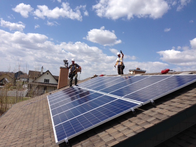 GREEN ENERGY – Sunfind Solar Products Inc. installs Terry Krause’s solar module on the roof of his home in Red Deer County this past June.