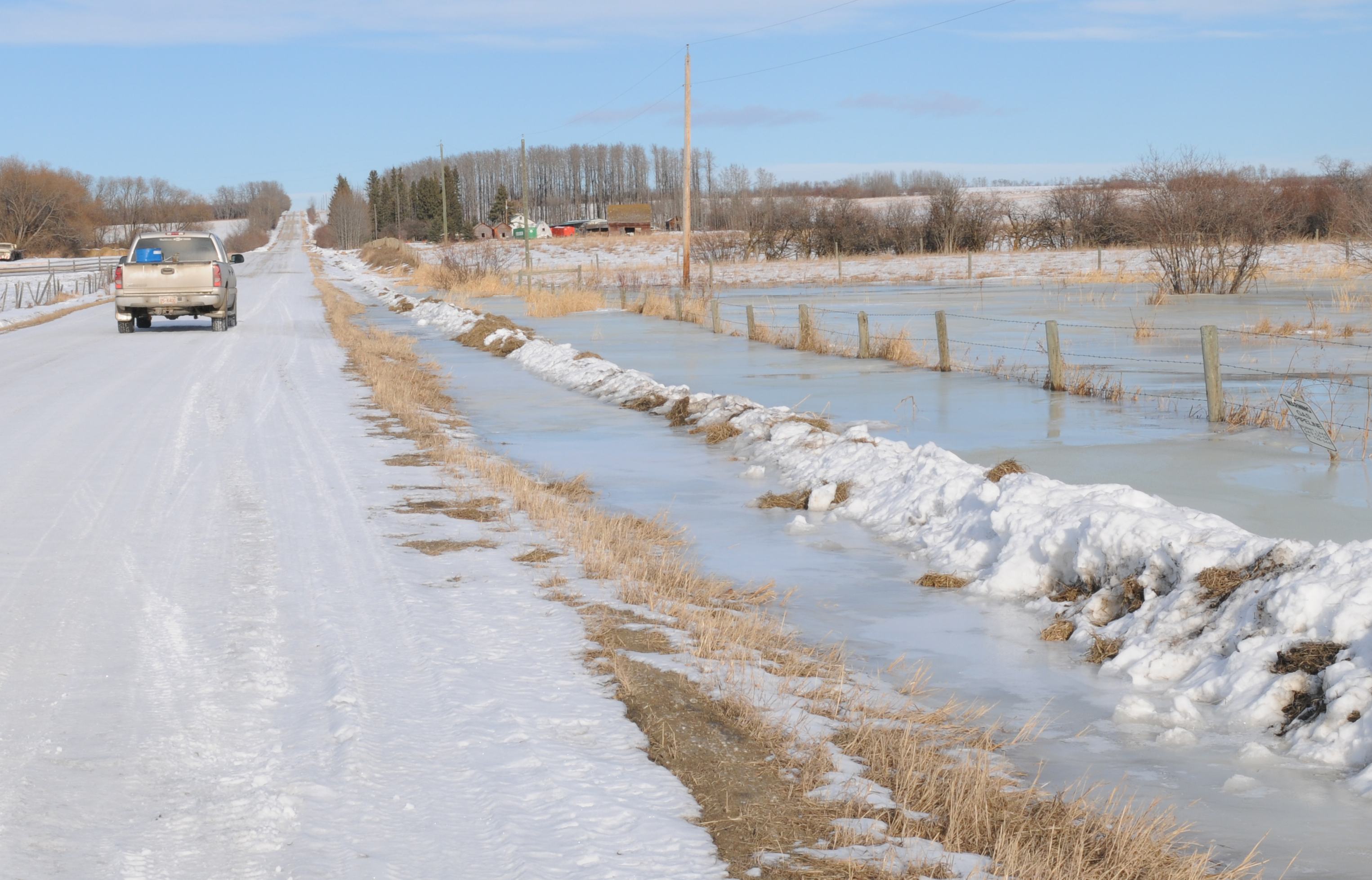 FLOOD- Due to the warm weather water has accumulated in a ditch along a Red Deer County road almost overflowing