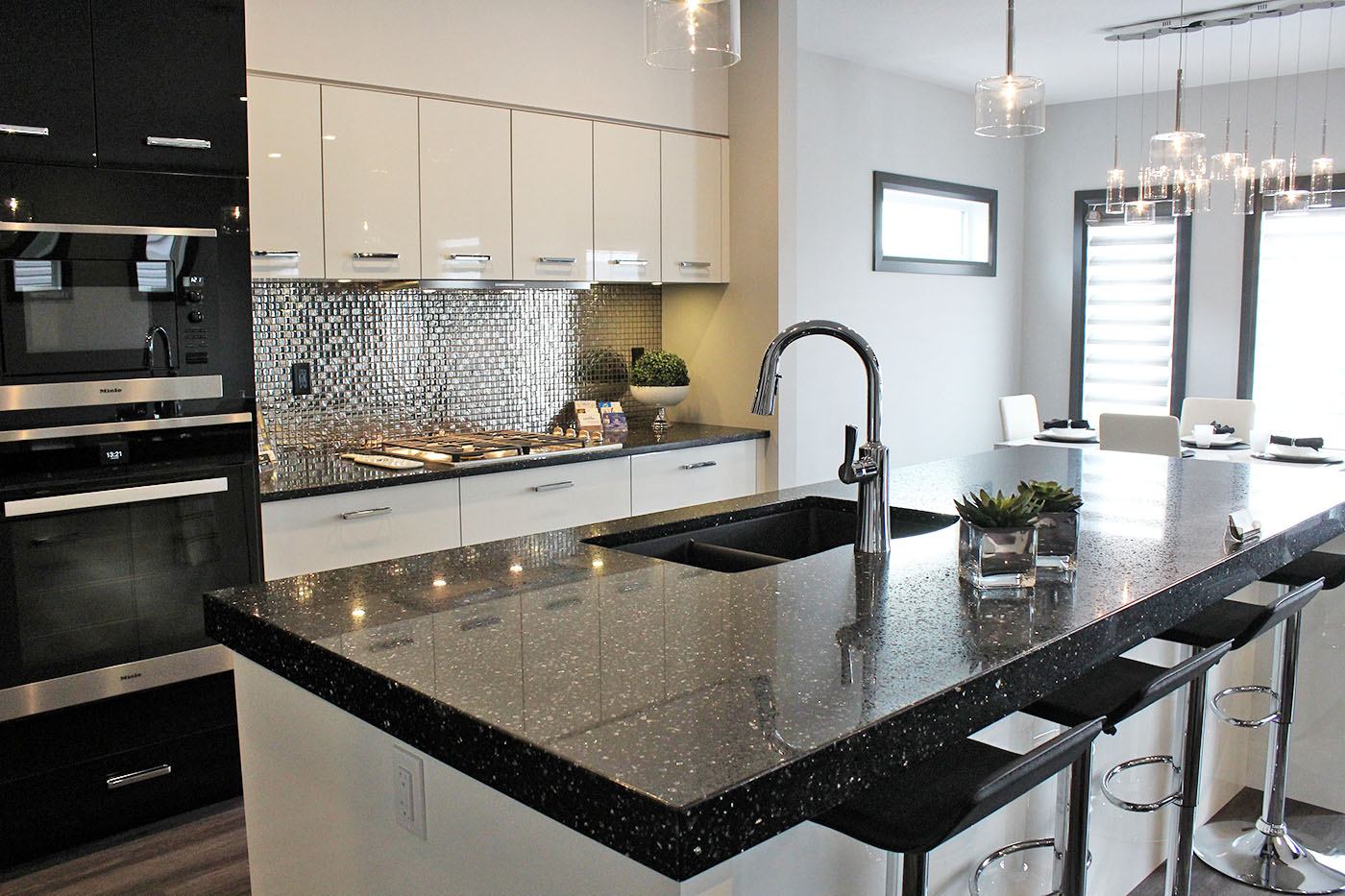 PRISTINE KITCHEN - This kitchen in a Unique Elevations show home on Larratt Close showcases enough space for entertaining.