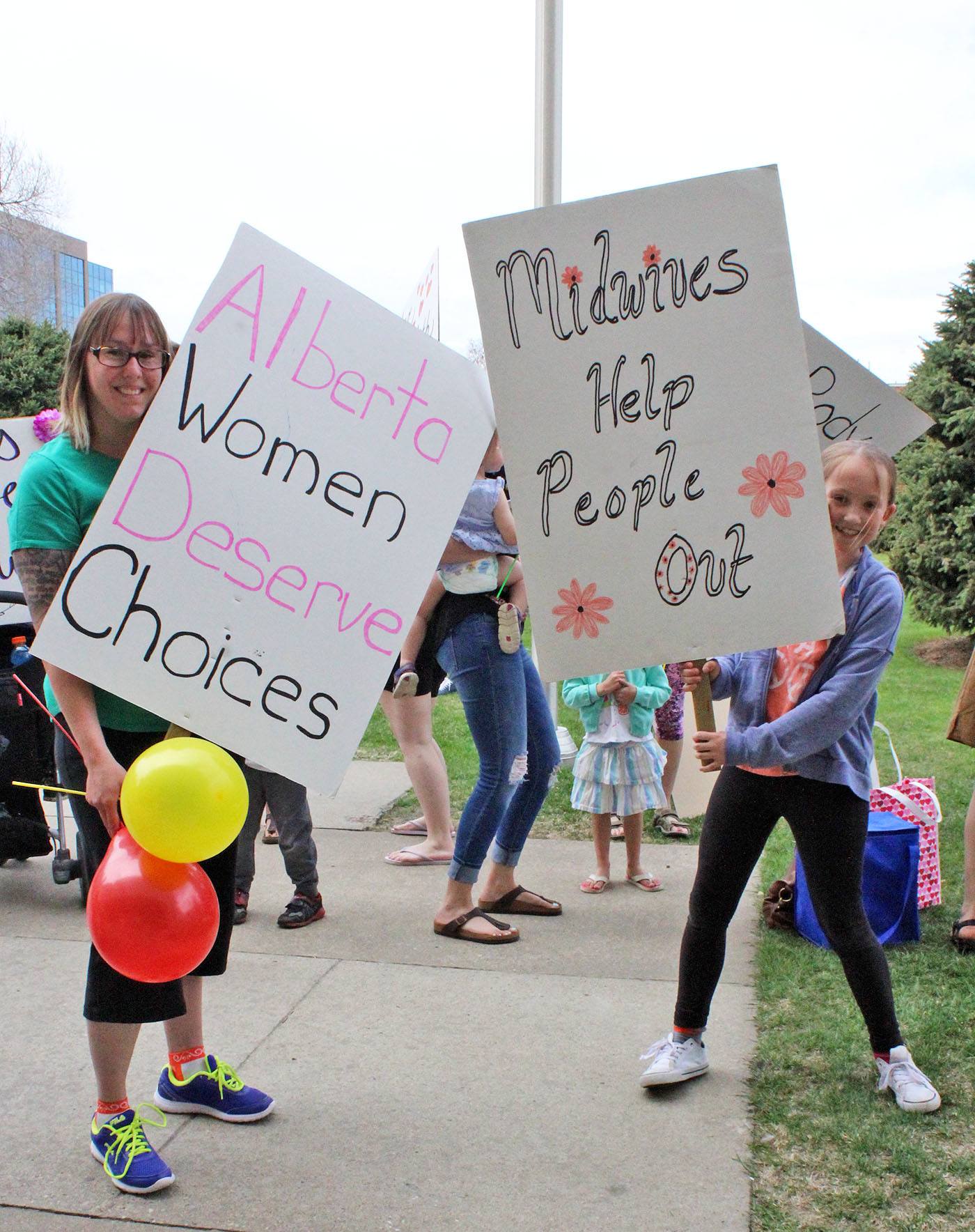 SUPPORTING MIDWIFERY - Kristine Deschenes and Alexis Deschenes took part in today's rally for midwifery at City Hall Park.