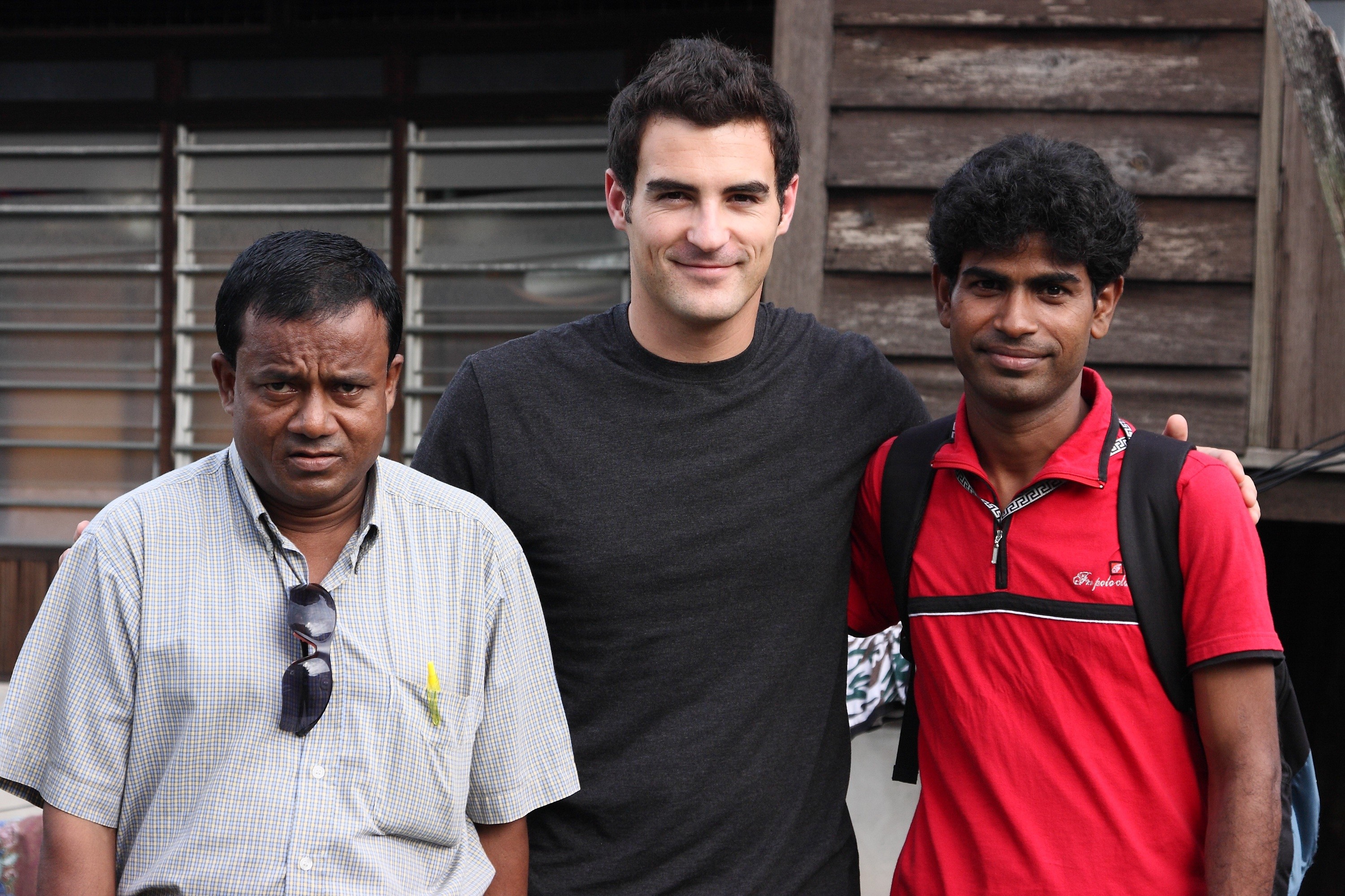 REACHING OUT – Local author Andrew Kooman spends time with Rohingya refugees from Burma during his December trip to Malaysia. He spent a month there to gather material for a new book about the plight of migrant workers and refugees in that country.