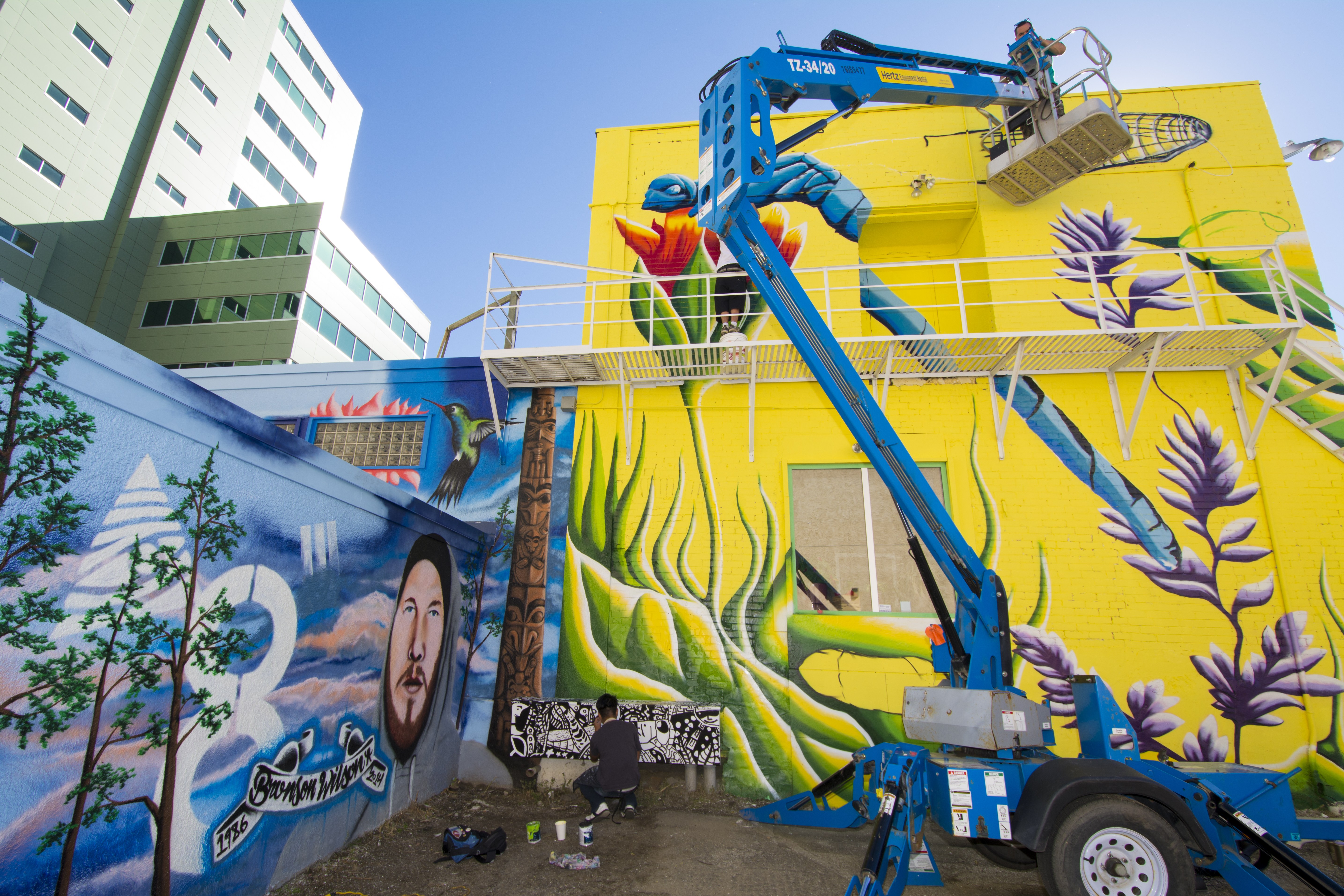 BEFORE AND AFTER – The alleyway behind the John Howard Society at 4916 50th St. has been beautified with a mural known as ‘Art Alley’.