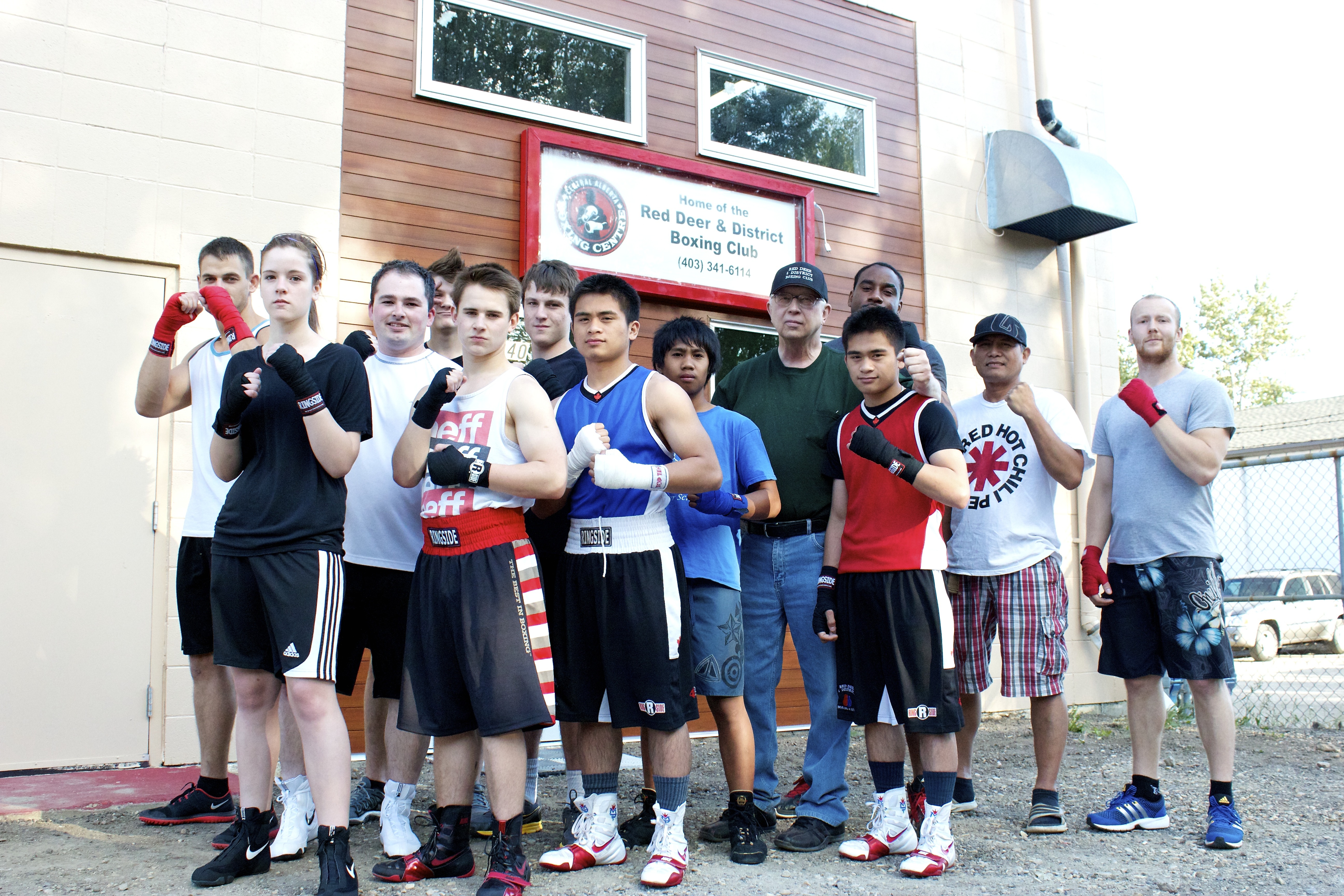 NEW CHAPTER - Members of the Red Deer & District Boxing Club gather in front of the recently-opened facility.