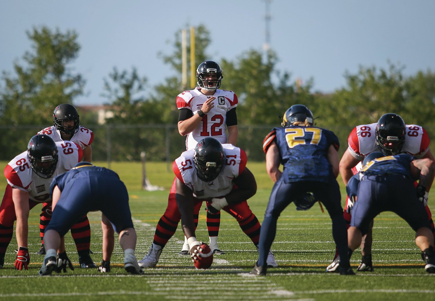 SURVEYING - Central Alberta Buccaneers starting quarterback Brandon Leyh surveyed the field for an open receiver during a game last year in Lacombe.