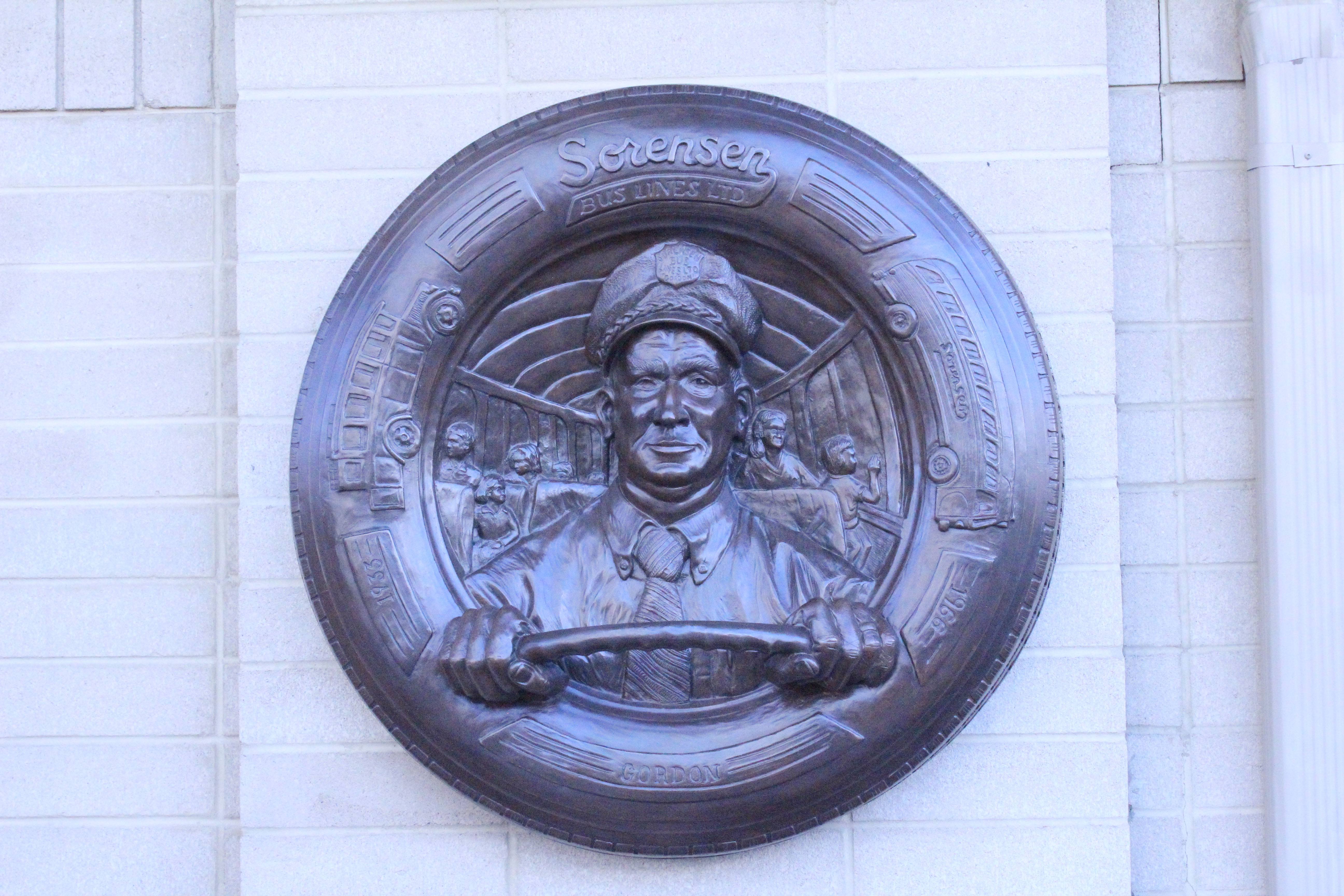REMEMBERED- This roundel features Gordon Sorensen's face as part of a six-part sculpture of Julietta and Gordon Sorensen. All six sculptures can be found at the Sorensen bus terminal down town Red Deer that is also named after the couple.