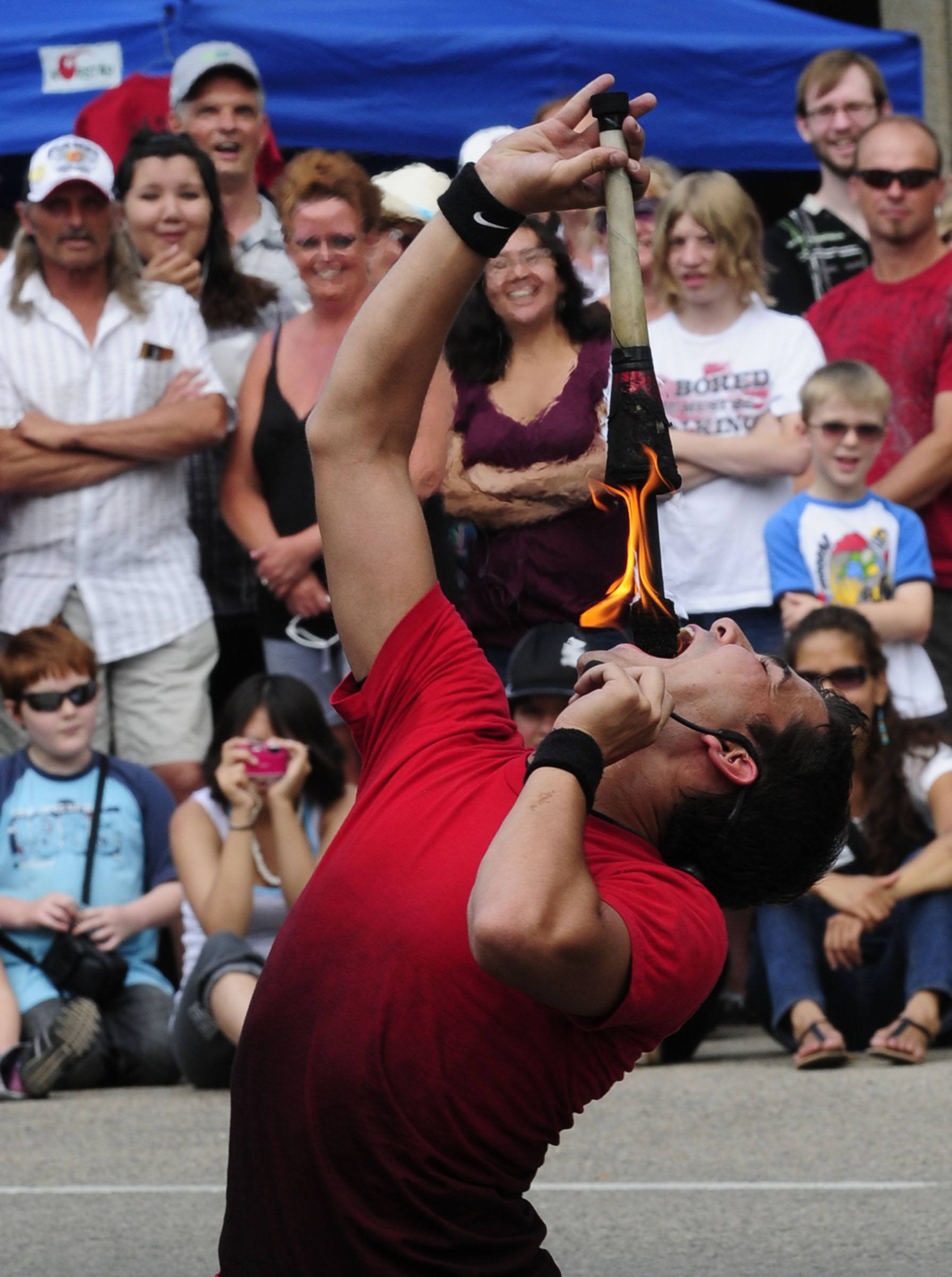 Daniel Craig of 'Street Circus' swallows a flame Sunday during CentreFest