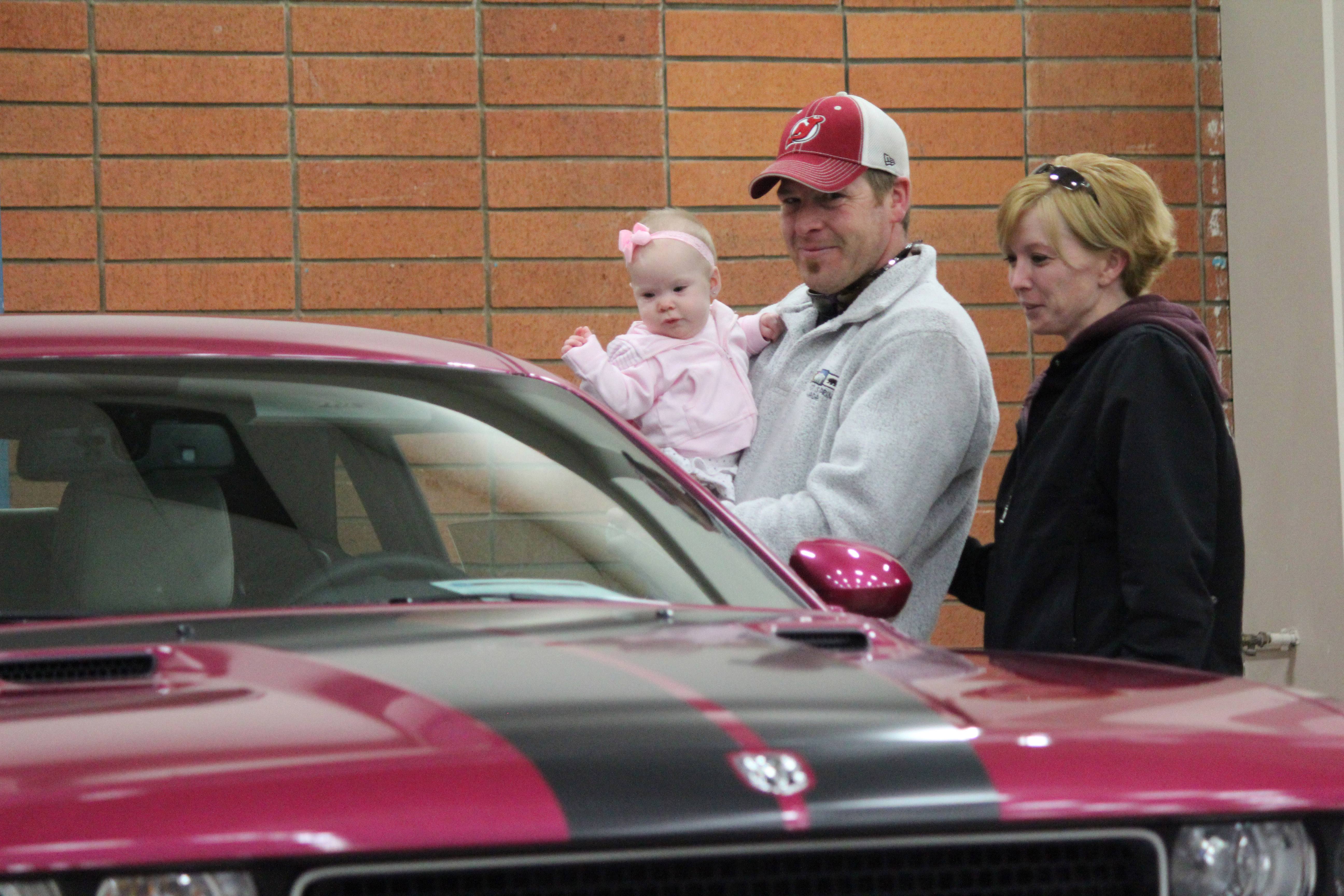 CAR GAZING- Mike and Kathy Beausoleil with their 7 month old daughter Jerzee check out the cars at the Red Deer Speed and Custom Show.