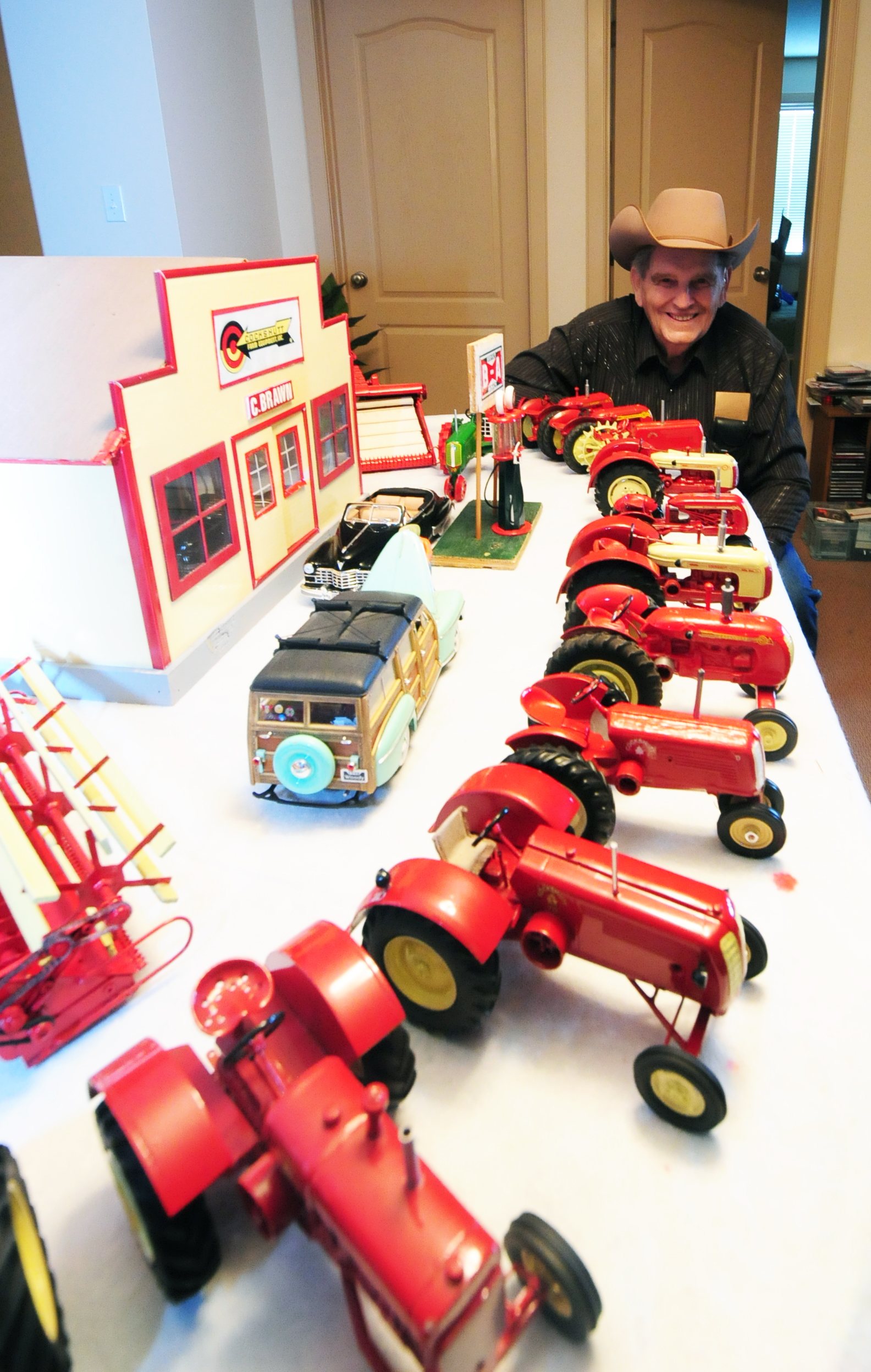 CHARLIE’S PRIDE- Charlie Brawn of Red Deer poses by some of his extensive collection of farm toys and models.