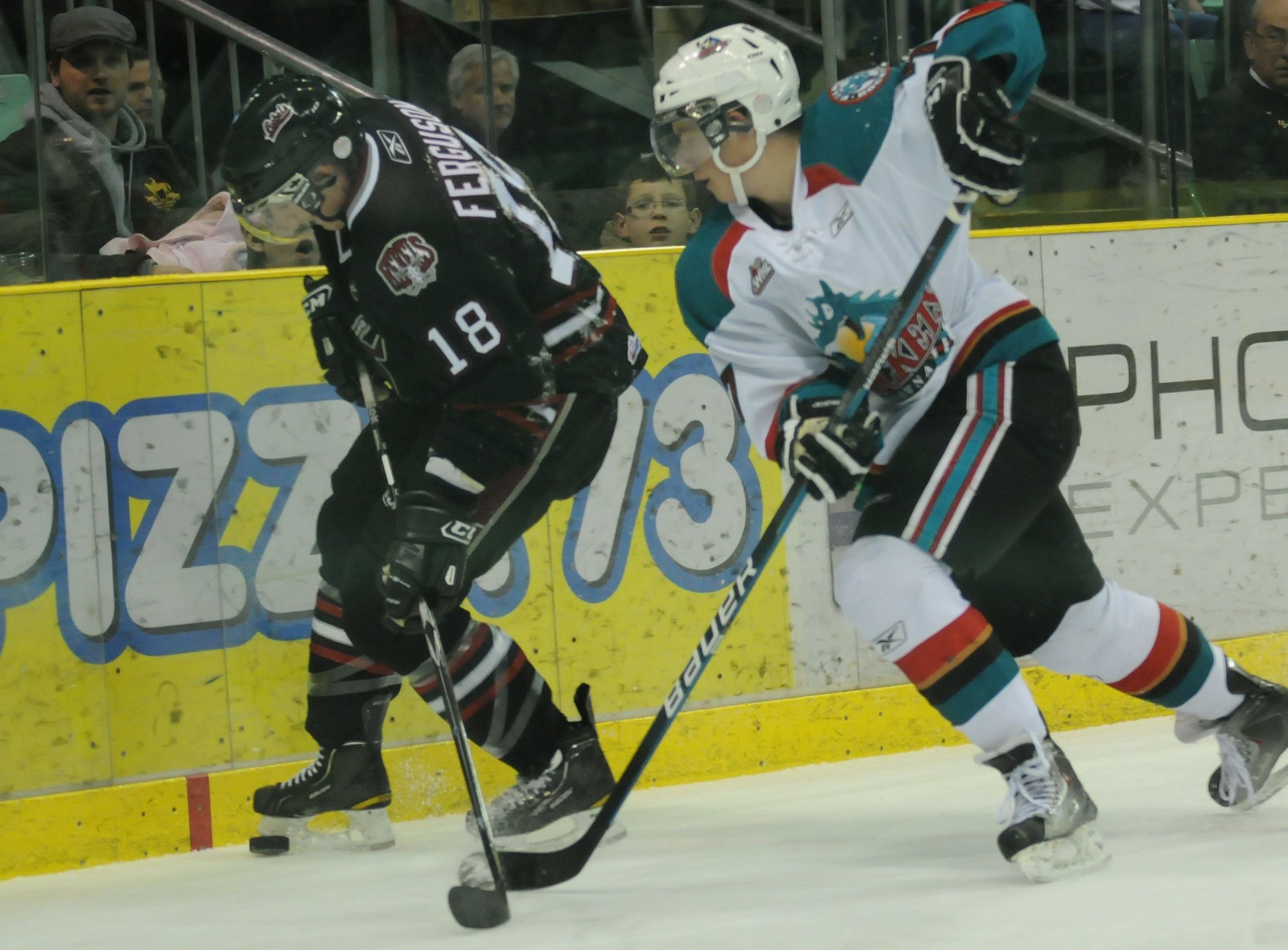 BIG LOSS- Red Deer Rebel Brett Ferguson fends off Damon Severson of Kelowna during WHL action Friday night. The Rebels lost 5-1 but will be able to redeem themselves Saturday night at the Centrium as they go up against Regina starting at 7:30 p.m.