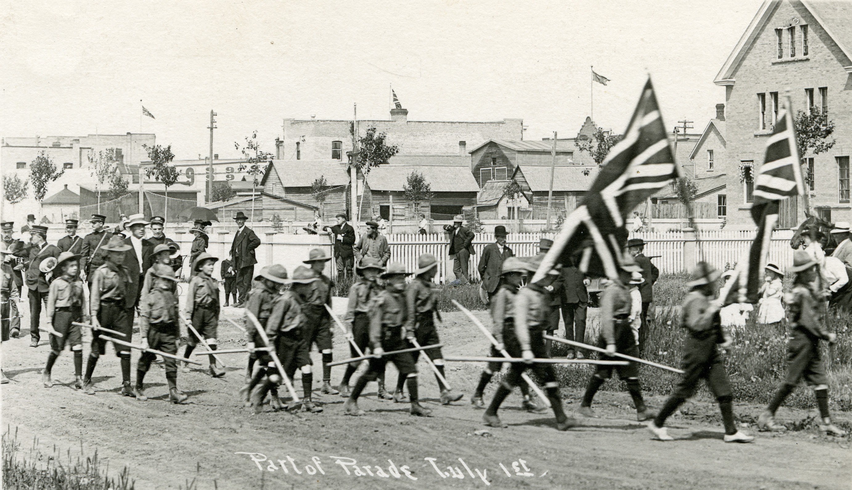 CELEBRATION - Red Deer’s Boy Scouts in the annual Dominion Day (July 1st) parade along Mann (49) St. across MacKenzie (49) Ave. and into the City Square (now City Hall Park). July 1st