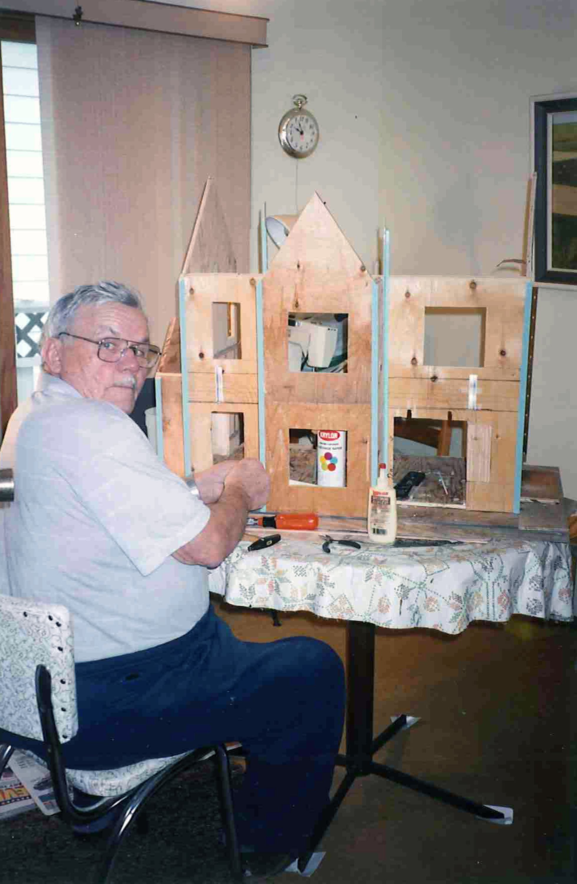 HANDCRAFTED – Pictured is Helmut Lemke working on one of the many dollhouses he designed before he died in 2008. Lemke’s family is donating most of the dollhouses to the Red Deer Regional Health Foundation.