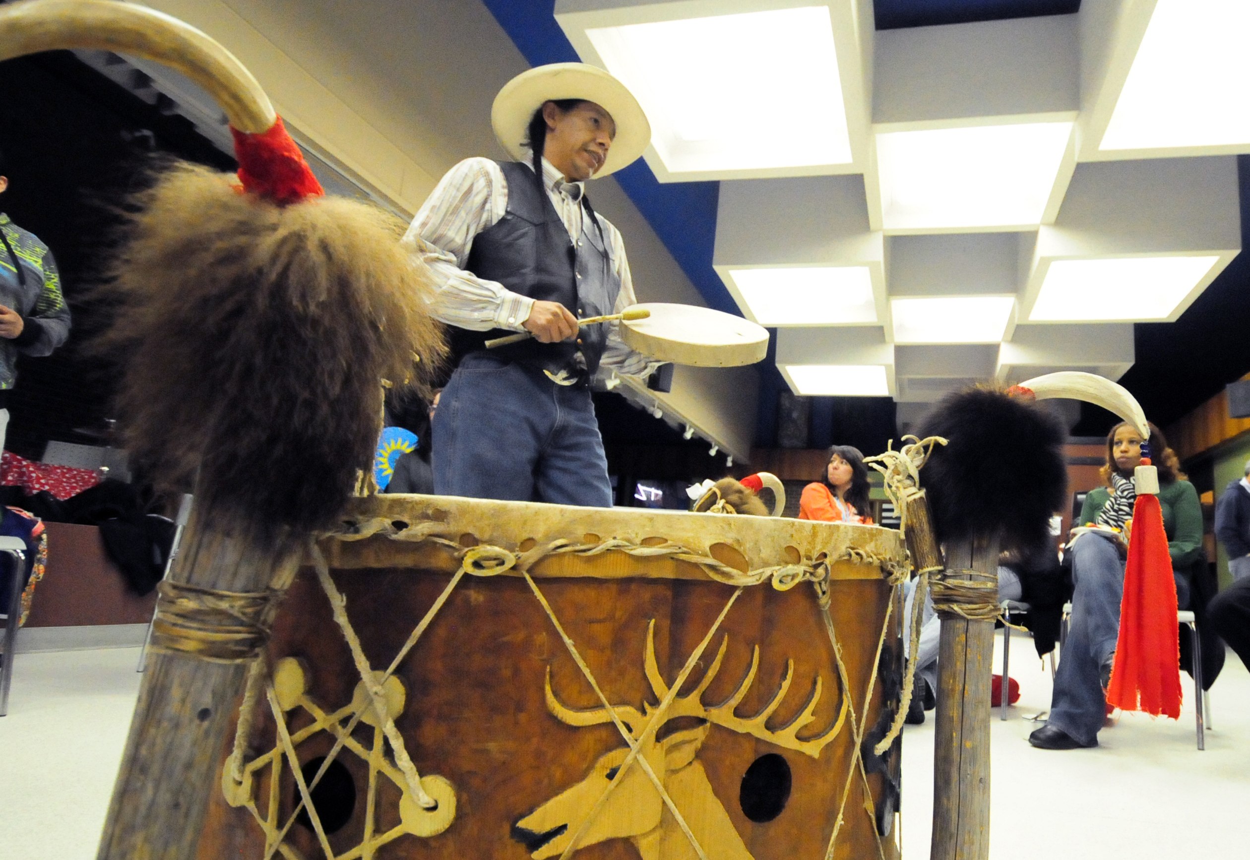 SOFT DRUMMING- Darcy Goodrunning sings an aboriginal song of prayer at the Hub recently while playing a drum to educate people on the aboriginal culture and the way of the drum.