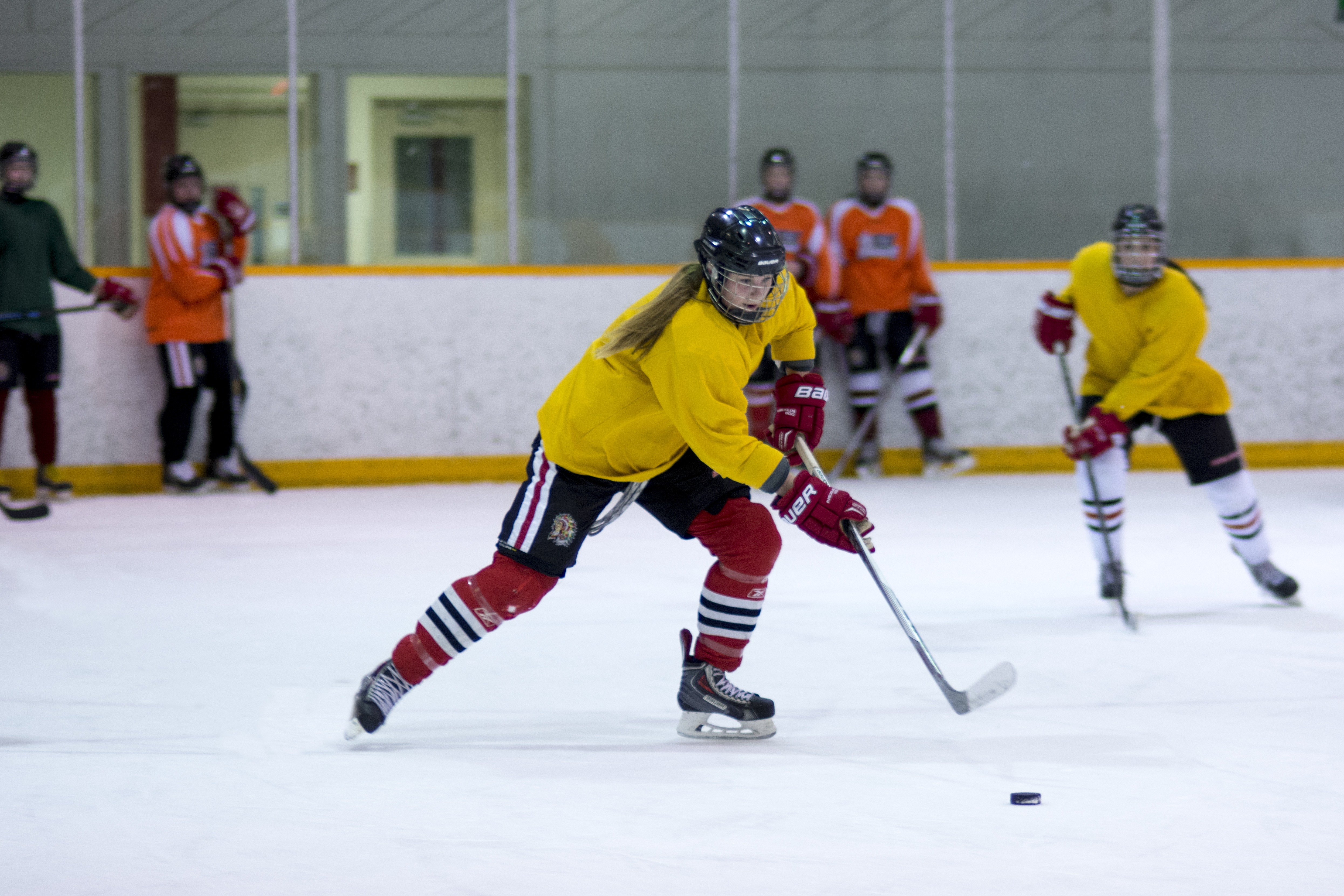 GEARING UP – Jordyn Burgar pushes the puck up the ice during a recent practice in preparation for the upcoming Esso Cup at the Red Deer Arena.