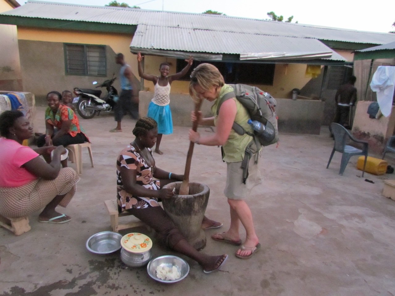 WORKING HARD- Pictured here is City Councillor Cindy Jefferies making foo-foo which is pounded boiled yam. She recently travelled to Ghana with Tools for Schools Africa to meet with young women who received scholarships from the program.