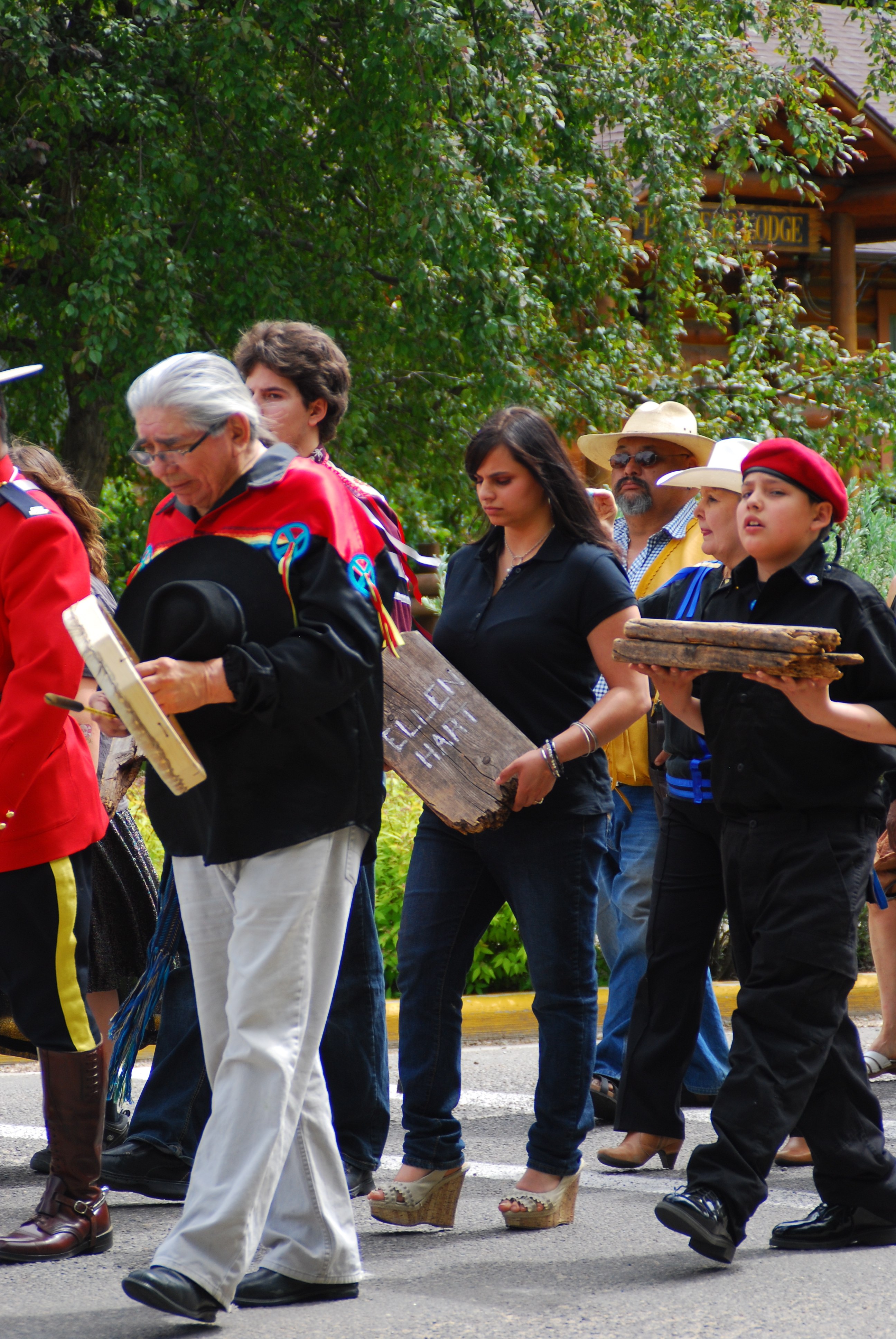 LONG JOURNEY- Adriana DuVal and Talon Lightning carry headboards from the Red Deer Industrial School cemetery. The headboards belonged to students who had attended the school from 1893 to 1919. They will be on display at the Red Deer Musuem + Art Gallery.