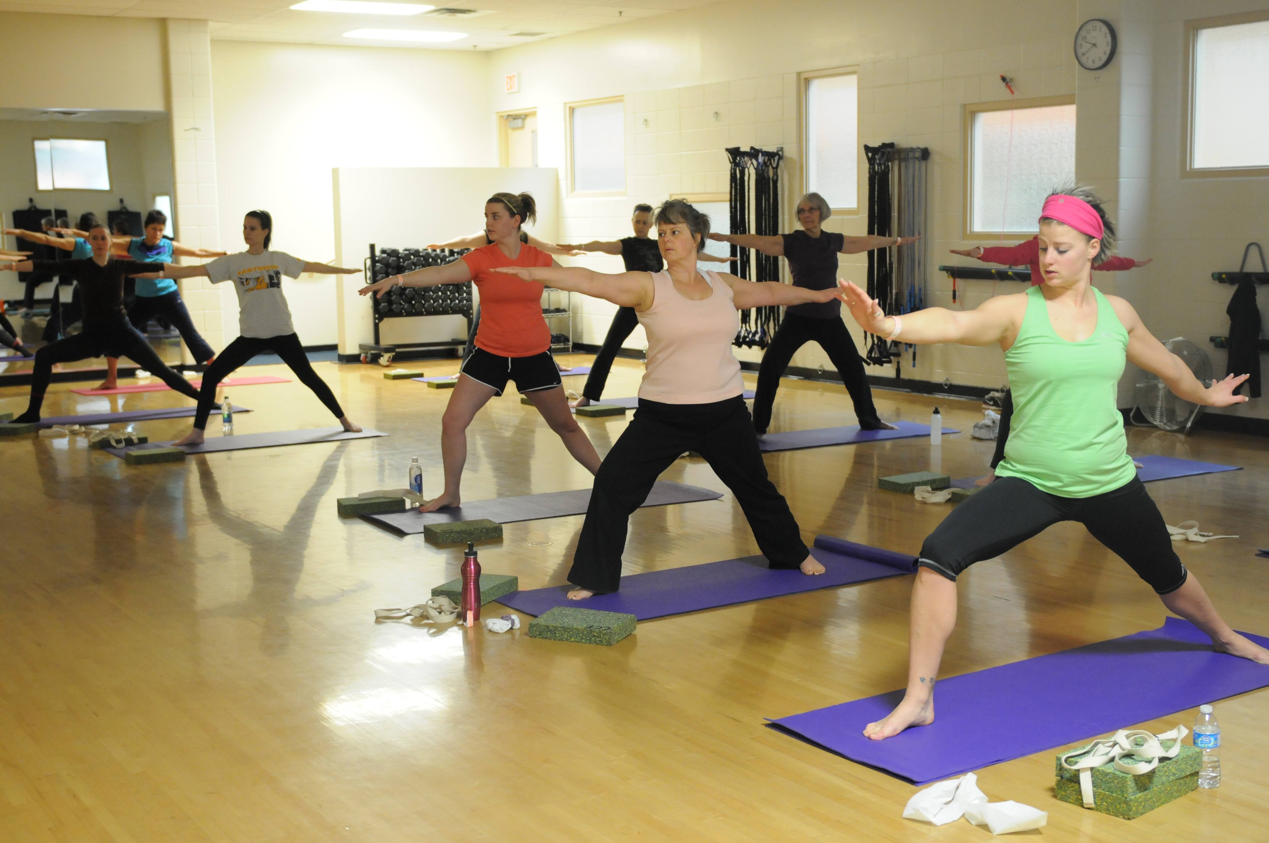 WARRIOR STANCE- Red Deerians participate in a Fusion yoga class at the Collicutt Centre recently.