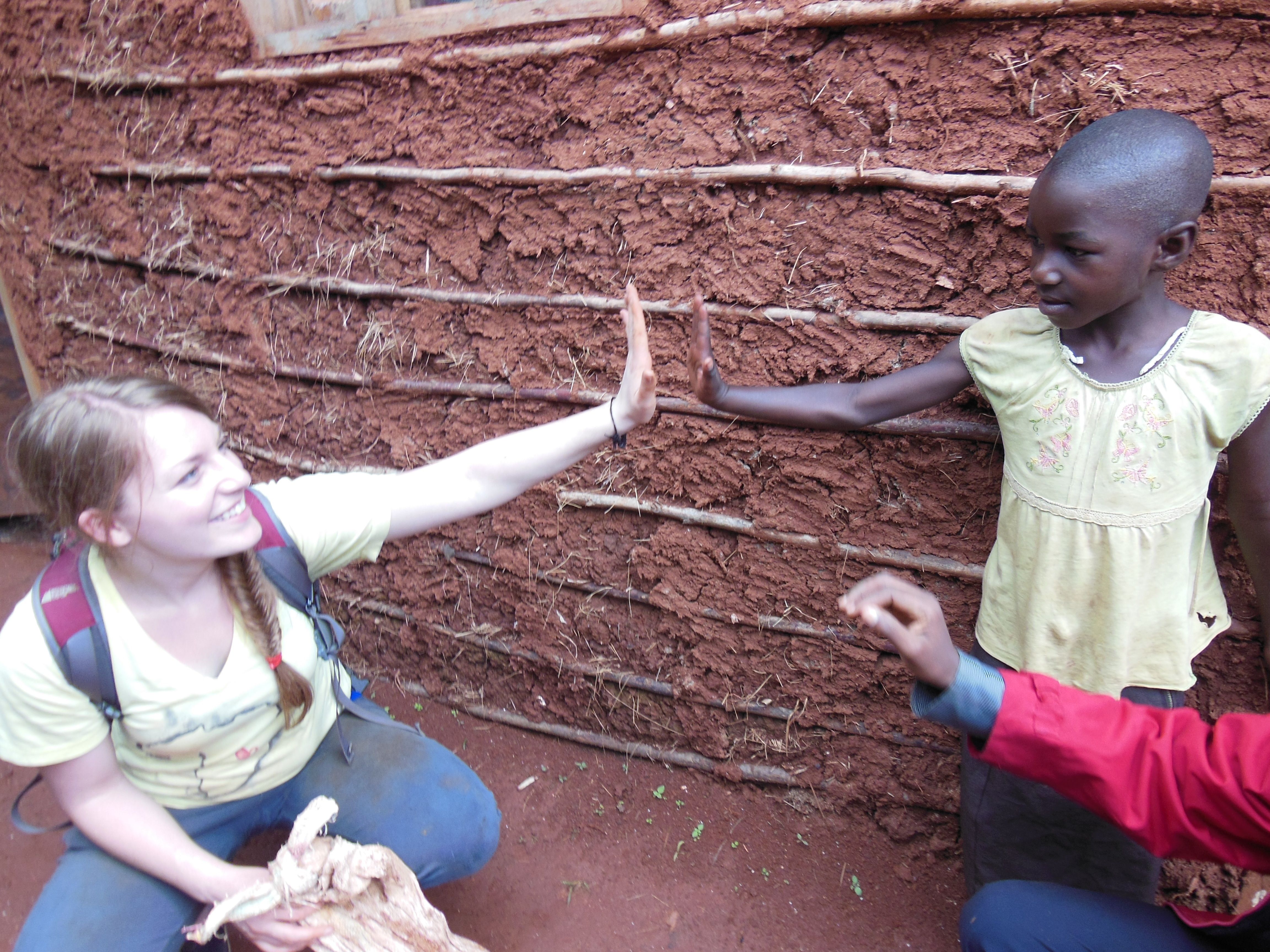 NEW FRIEND – Red Deer resident Susan Pankiw spends time with a youngster during a visit to Kamembe