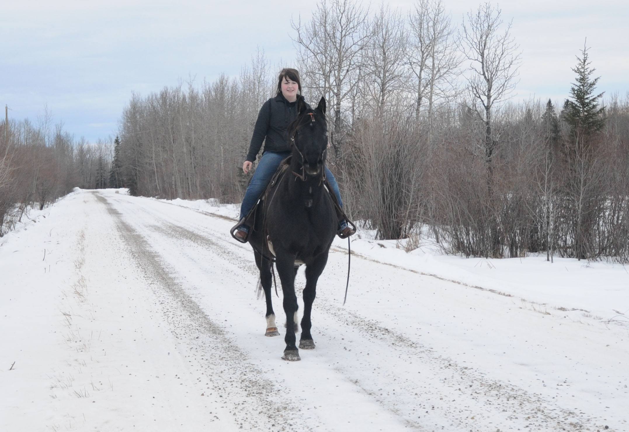 COUNTRY RIDE- Megan Klain takes her horse Ben for a little ride along a country road recently.