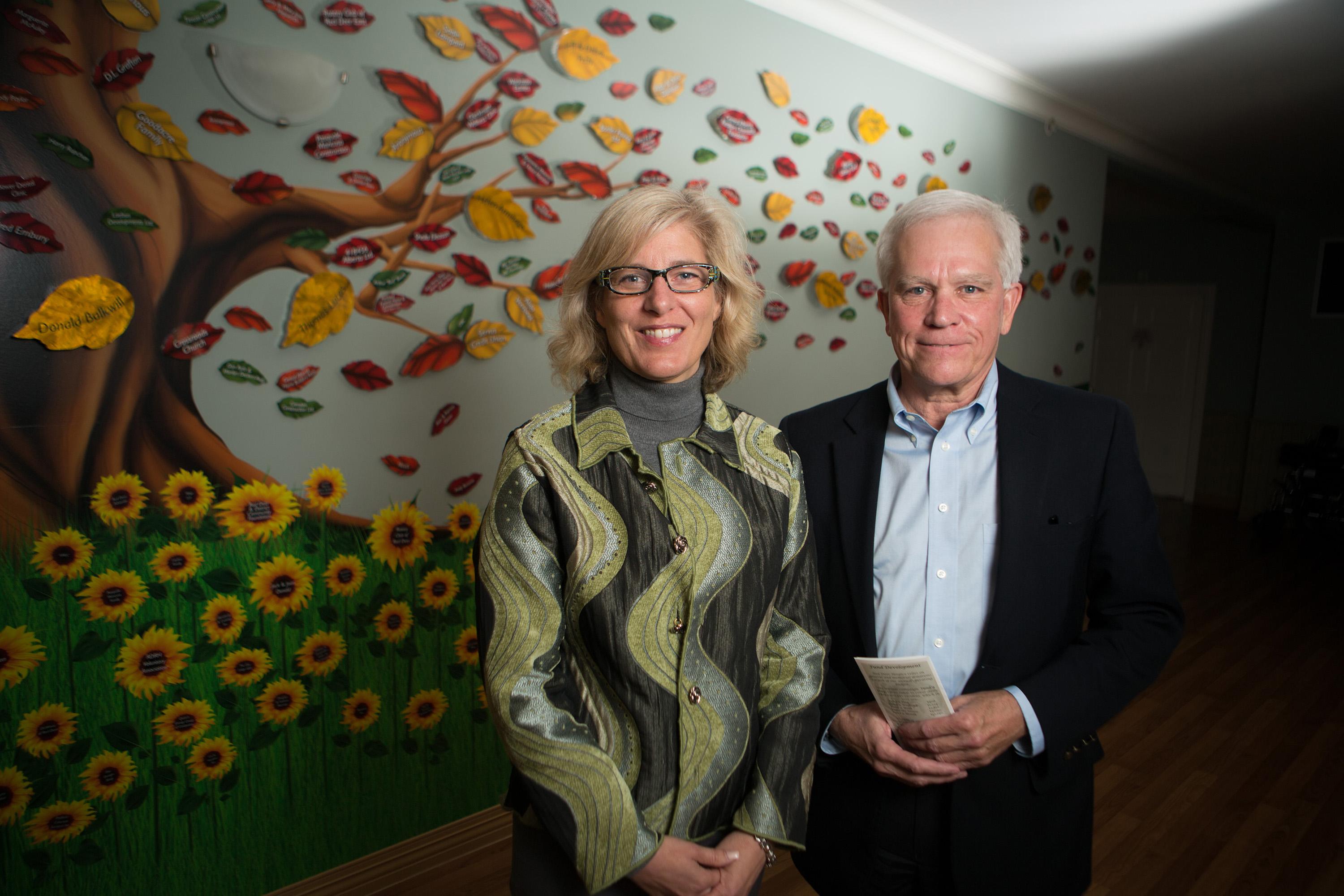 MILESTONE - Suzanne Alexander-Smith and Bryan Wilson stand by the donor wall of the Red Deer Hospice last week. The Hospice recently marked 10 years of service to the community.