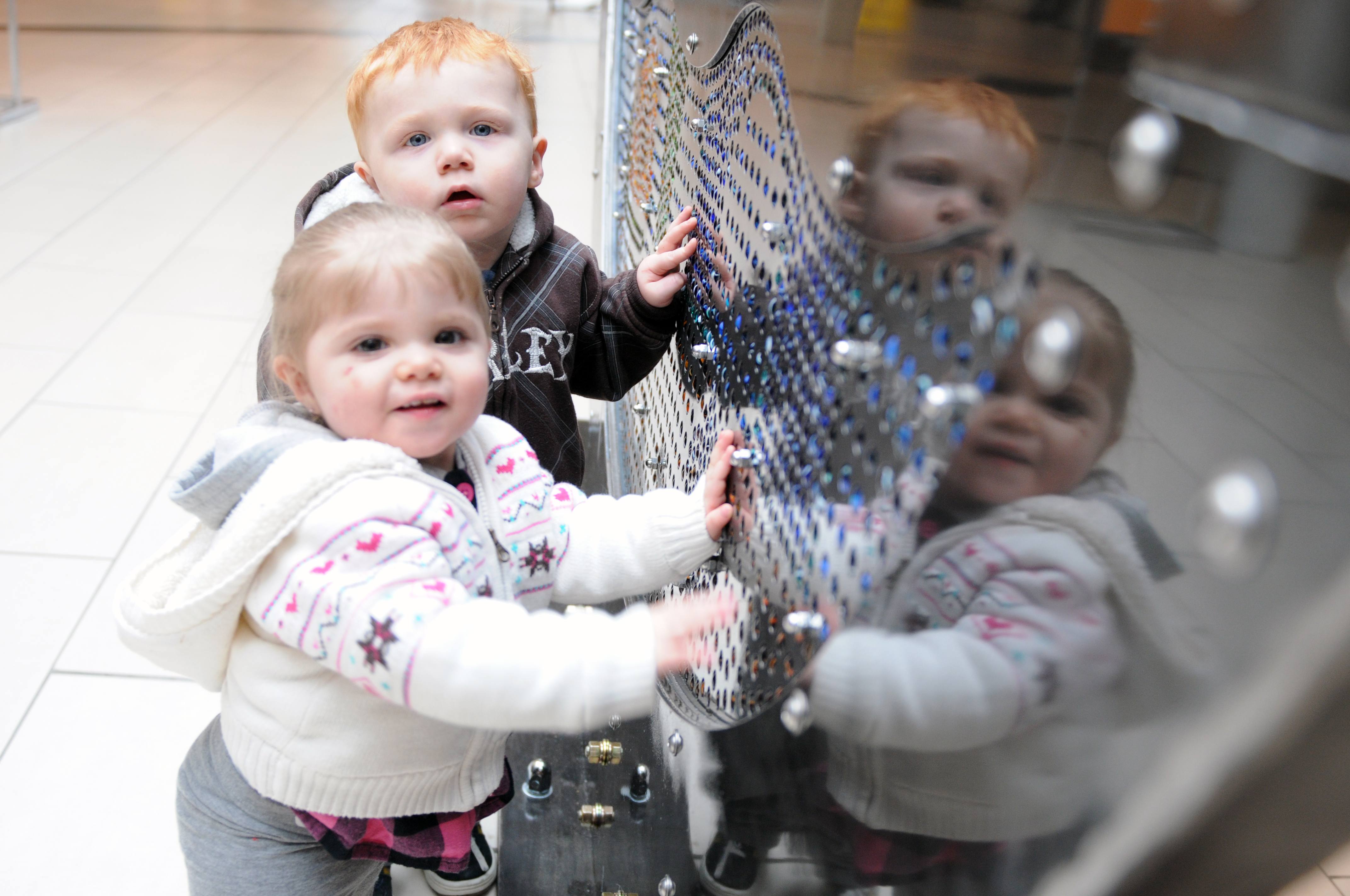 CURIOUS- Twins Brooklyn and Bretton Pittman check out the marble artwork display at the Dawe Centre this past weekend.