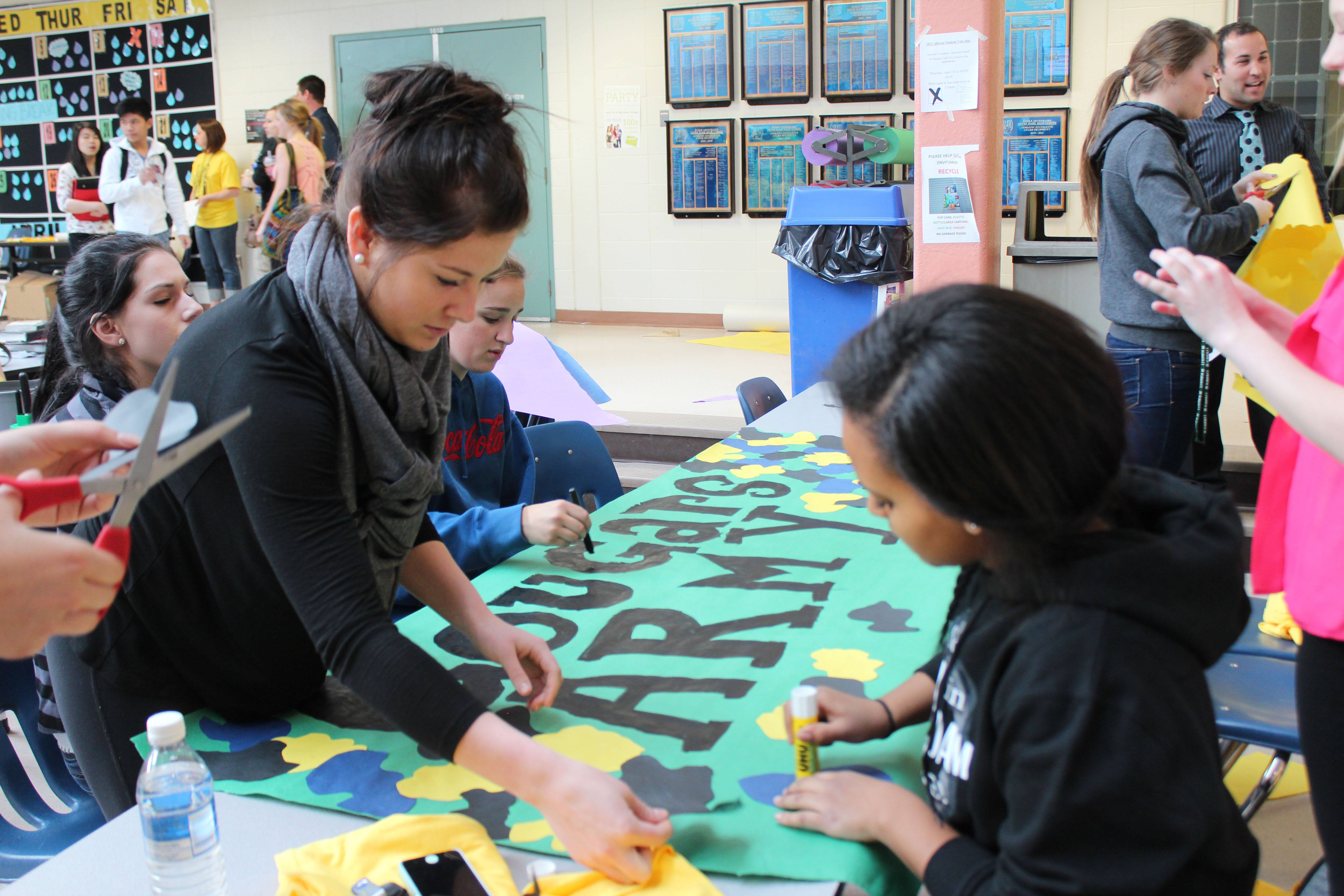 BETTER TOGETHER- Notre Dame students put together a team banner as part of their first challenge in their grad service project.