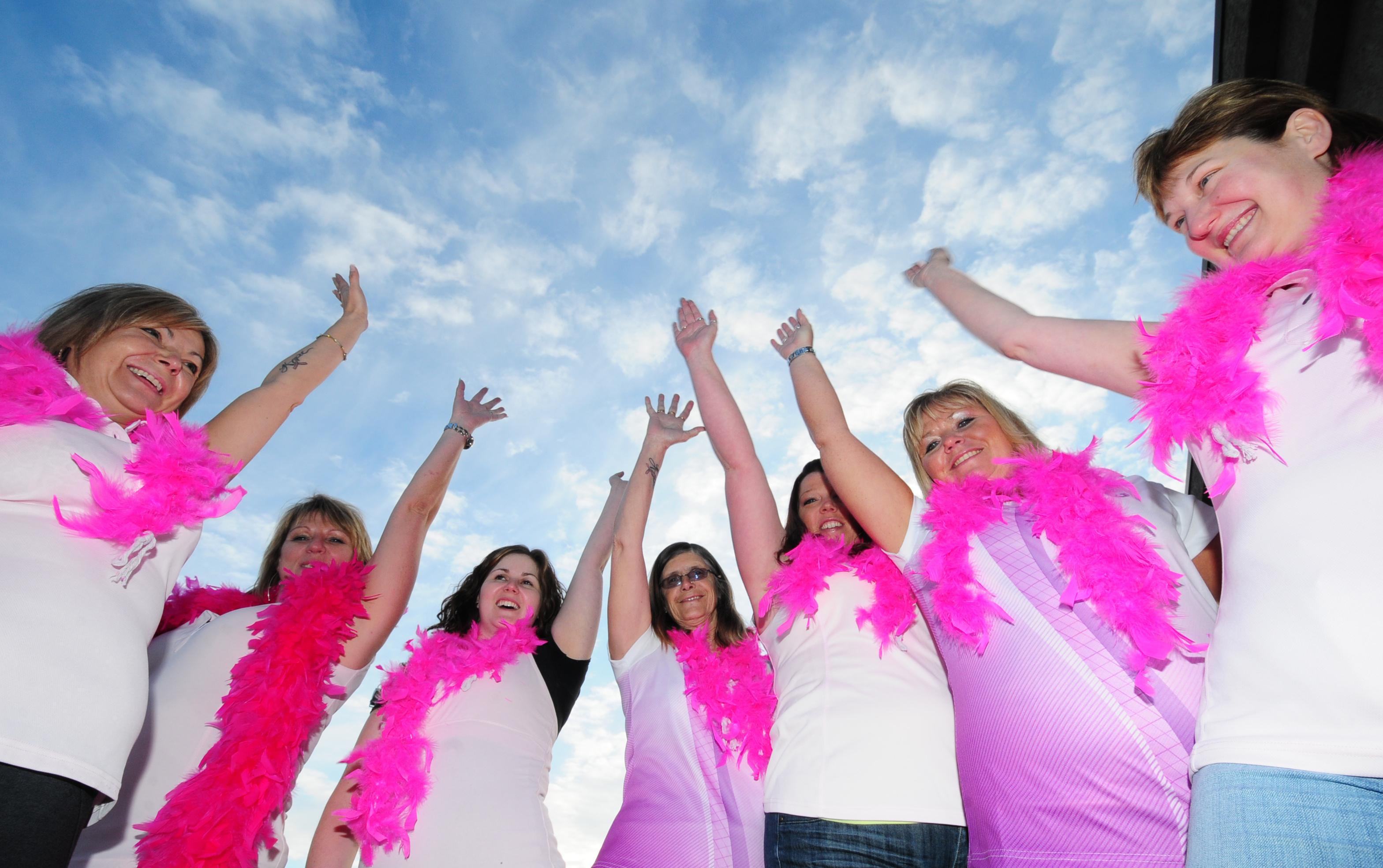 TEAMWORK - Seven of the 12 members of 'Perky in Pink' raise their hands in a cheer as this is their sixth year participating in the Weekend to End Women's Cancers in Calgary.