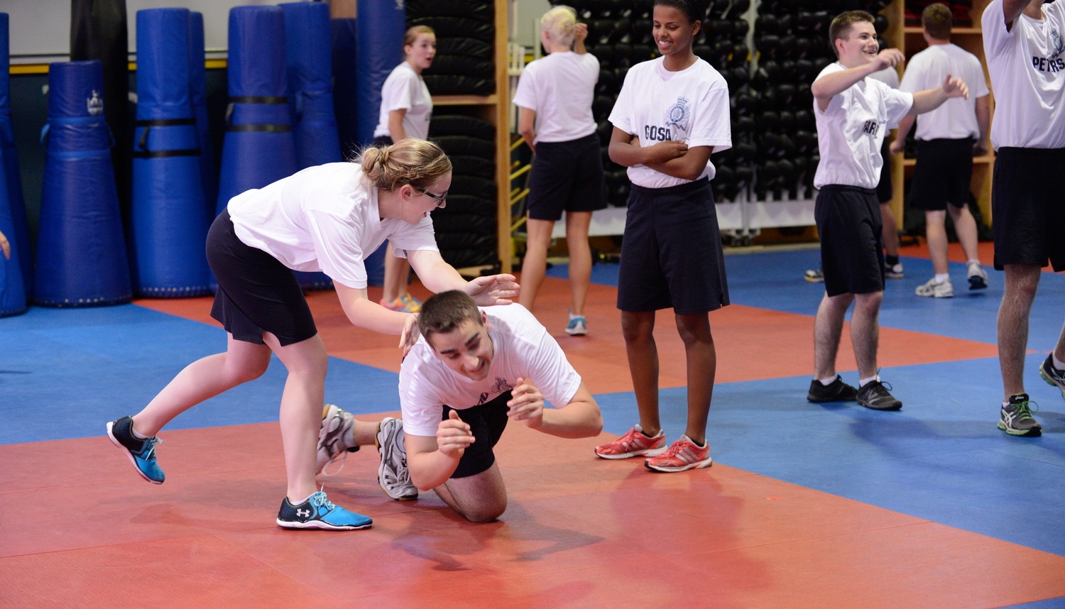 NEW SKILLS - Tatyana Henderson performs a take down on a fellow youth camp participant. Henderson recently returned from the RCMP Youth Camp where she learned what it was like to be a part of the RCMP Academy.