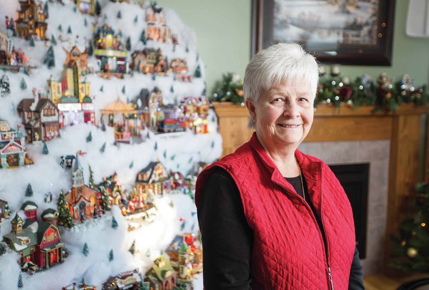 CHRISTMAS TRADITION - Linda Saretzky spent some time looking at her huge Christmas village display in her home in Red Deer. Saretzky and her husband have always been huge lovers of Christmas. See our slideshow at www.reddeerexpress.com.