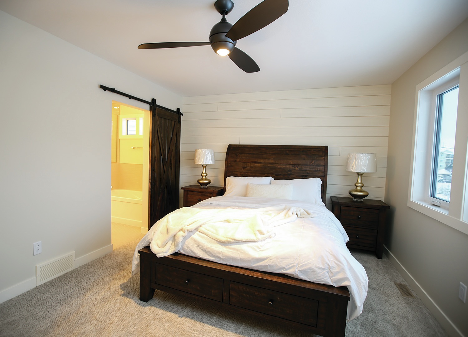 RUSTIC CHARM - This master bedroom in a Parkland Builders Group Limited show home in Laredo showcases how simple