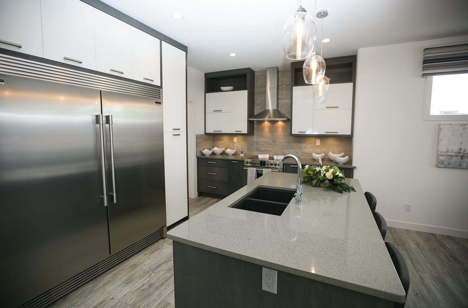 INVITING - This kitchen area in the Hospitals’ Home Lottery dream home designed by Sorento Custom Homes shows how a single splash of colour can really make a room pop.