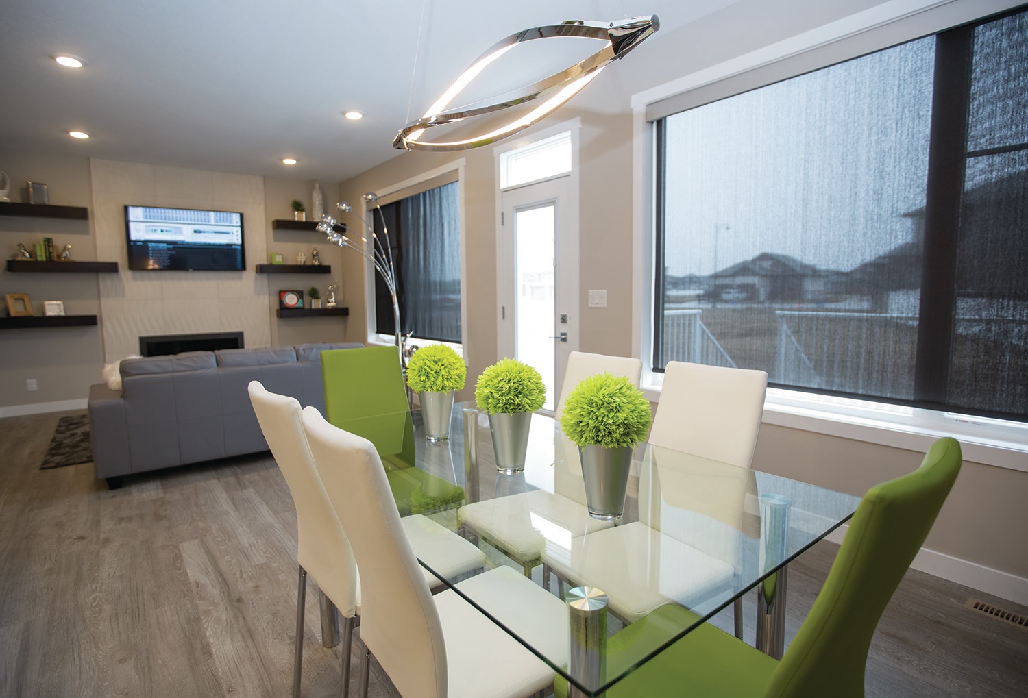 INVITING - This dining area in an Asset Builders show home in Laredo shows how decor can be used to blend two rooms together into a coherent space.