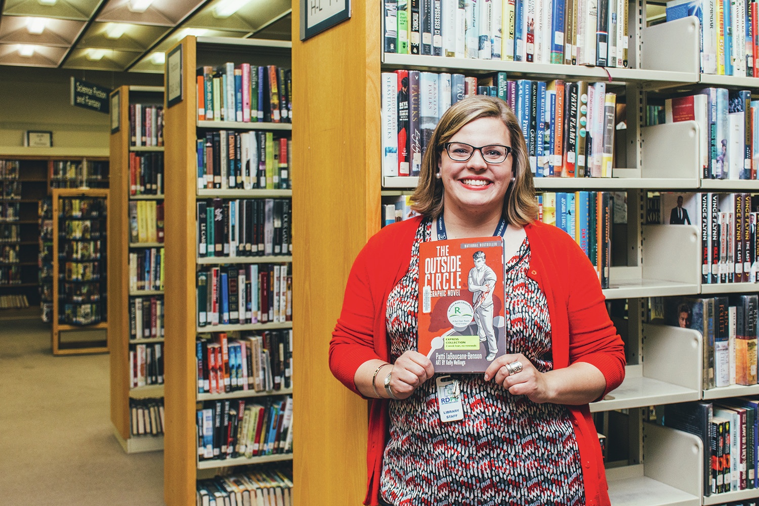 RED DEER READS - Briana Ehnes of the Red Deer Public Library shows a copy of The Outside Circle by Patti LaBoucane-Benson and illustrated by Kelly Mellings in the downtown branch recently. The Outside Circle was picked this year for the Red Deer Reads program which is hosted by the Library.