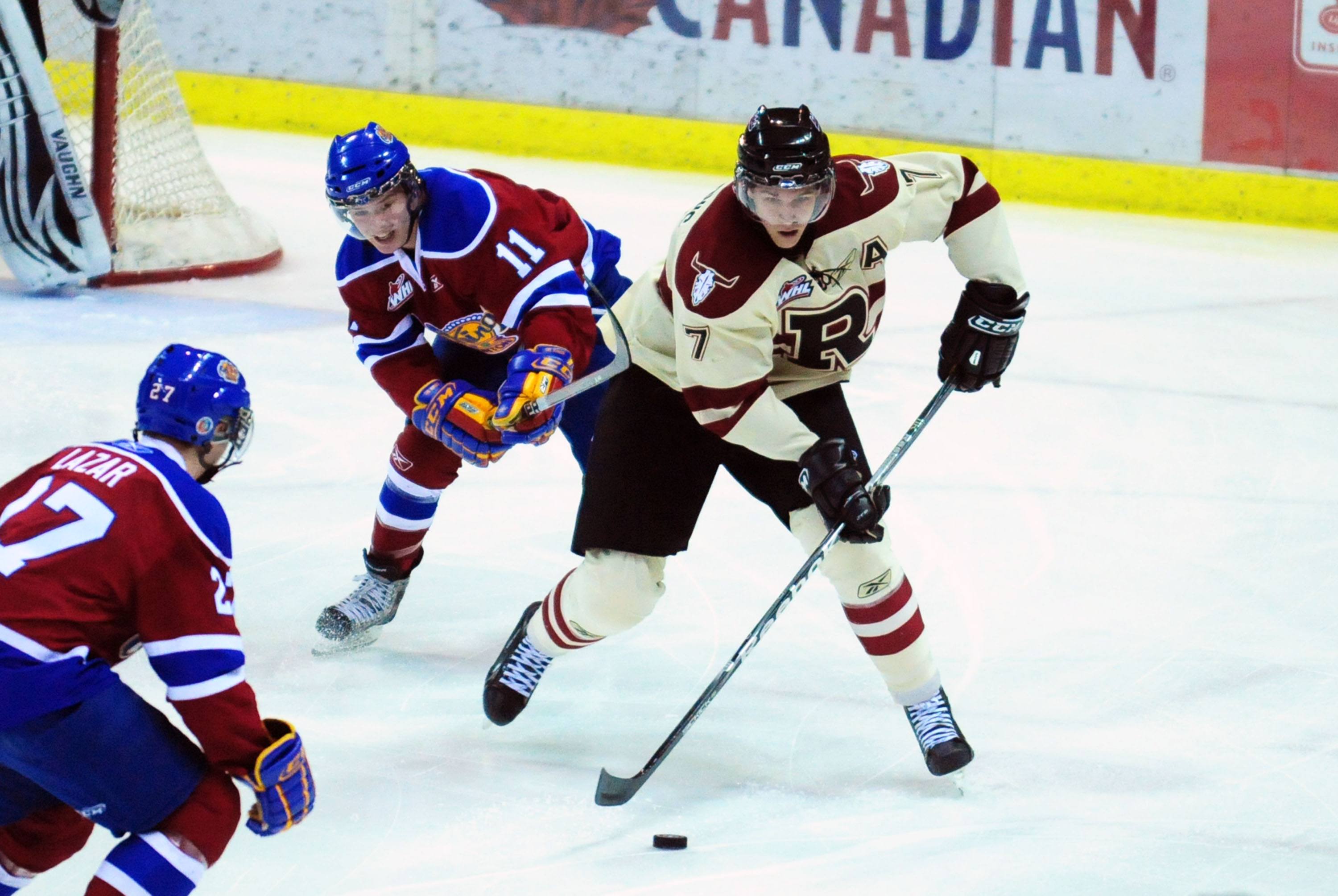 PUCK STEALING- Red Deer Rebel Alex Petrovic steals the puck away from the Edmonton Oil Kings during WHL action Saturday night. The Rebels won 3-1.