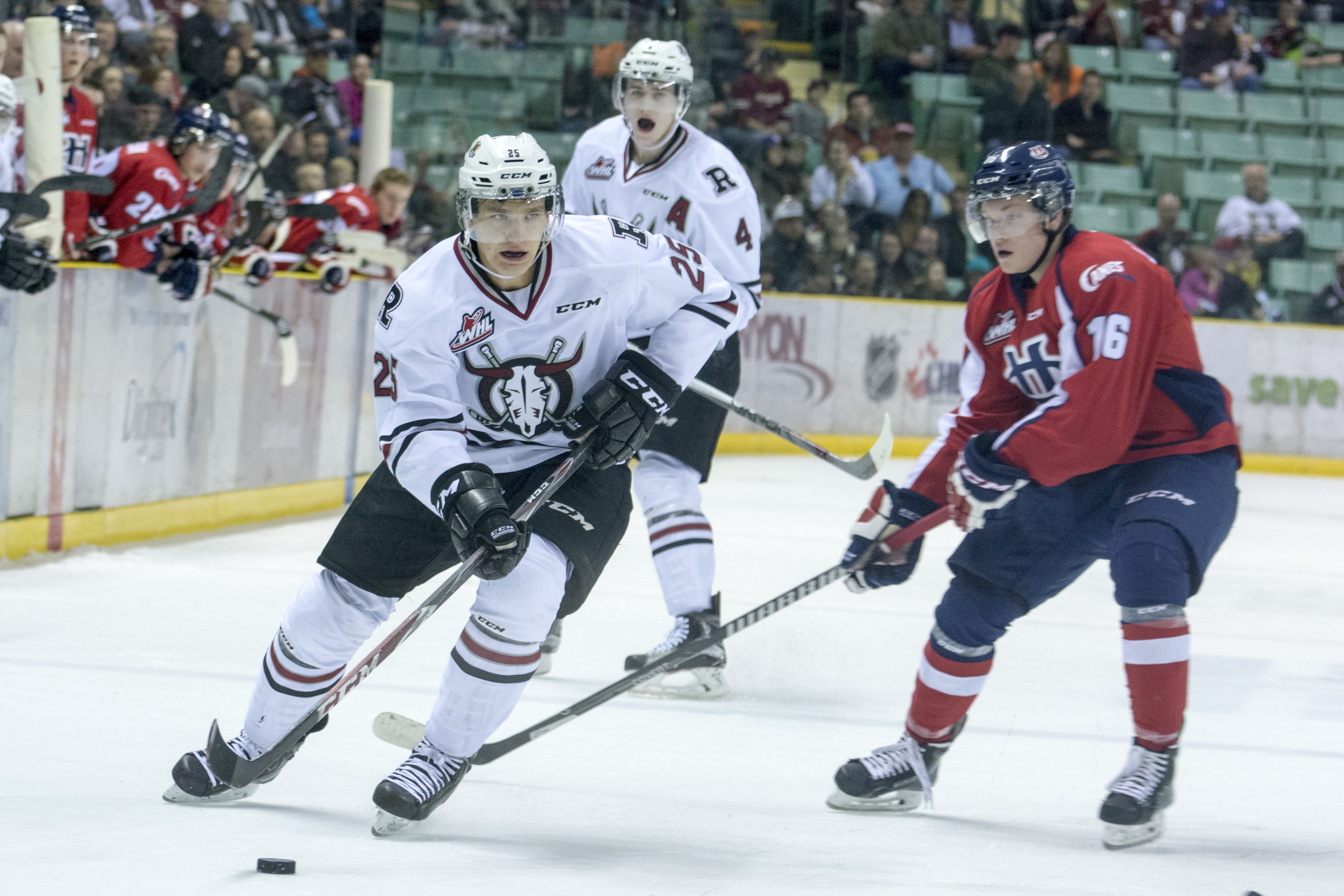 HARD LOSS – Rebel’s centre Adam Musil drives for the net against Hurricane’s centre Ryley Lindgren during last Friday night’s game at the Enmax Centrium which left the Hurricanes in a 2-1 lead.