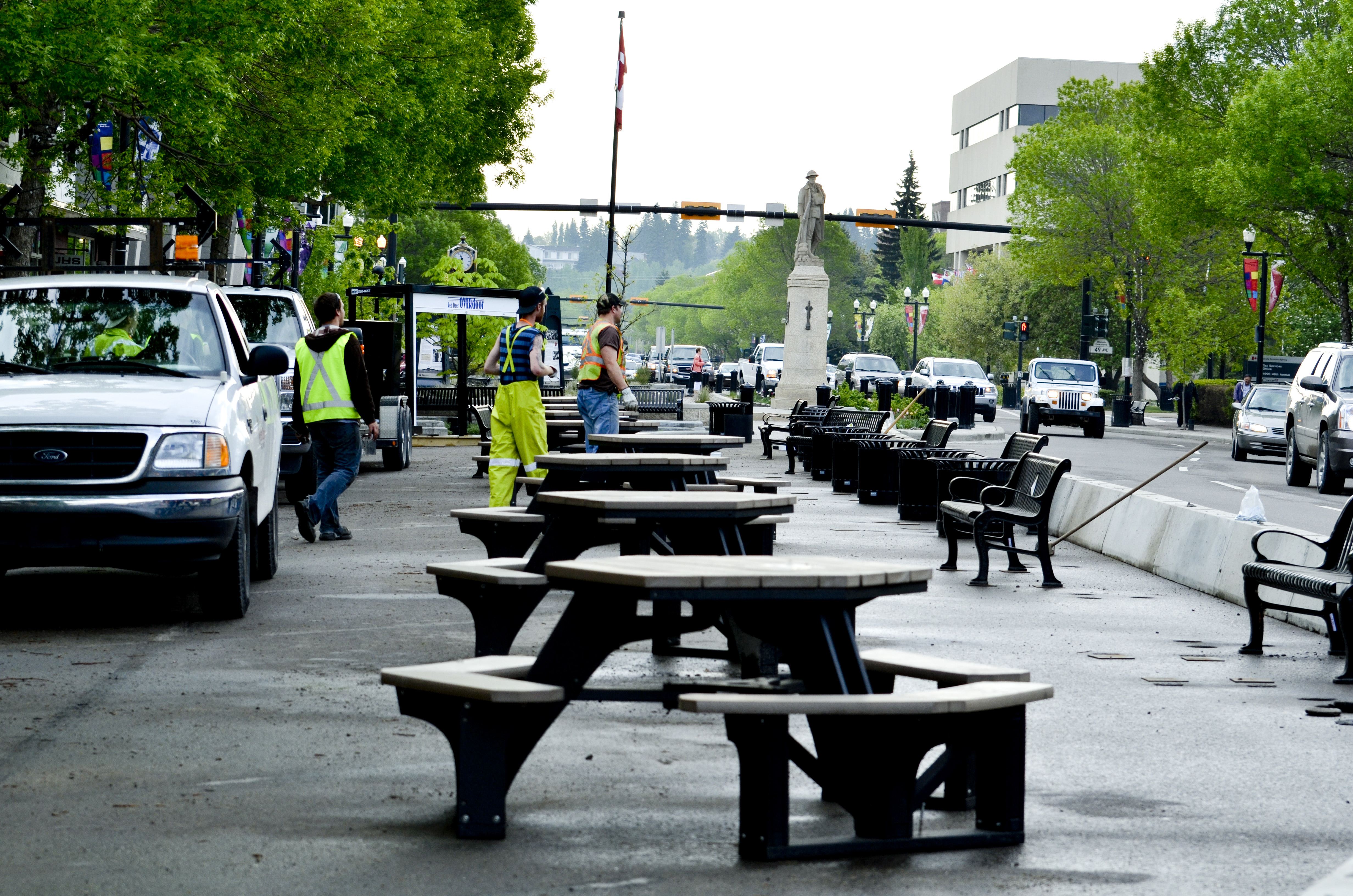 RENOVATION – City of Red Deer workers put up barricades and tables for the annual Ross Street Patio.