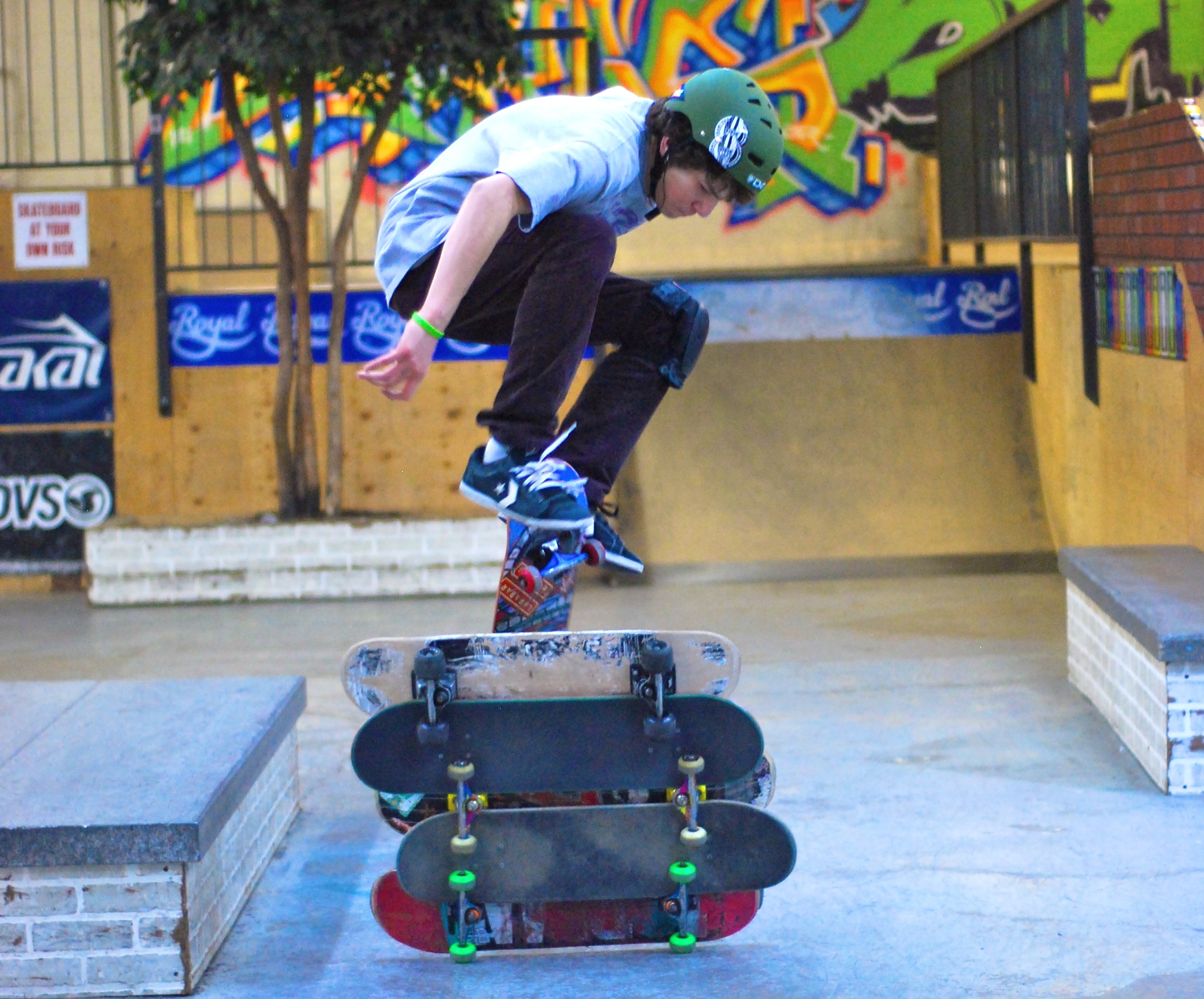 BOARD BUDDIES- Jordan Duperron jumps four skateboards in a friendly competition with five of his friends at Vertical Edge Skate Park recently.