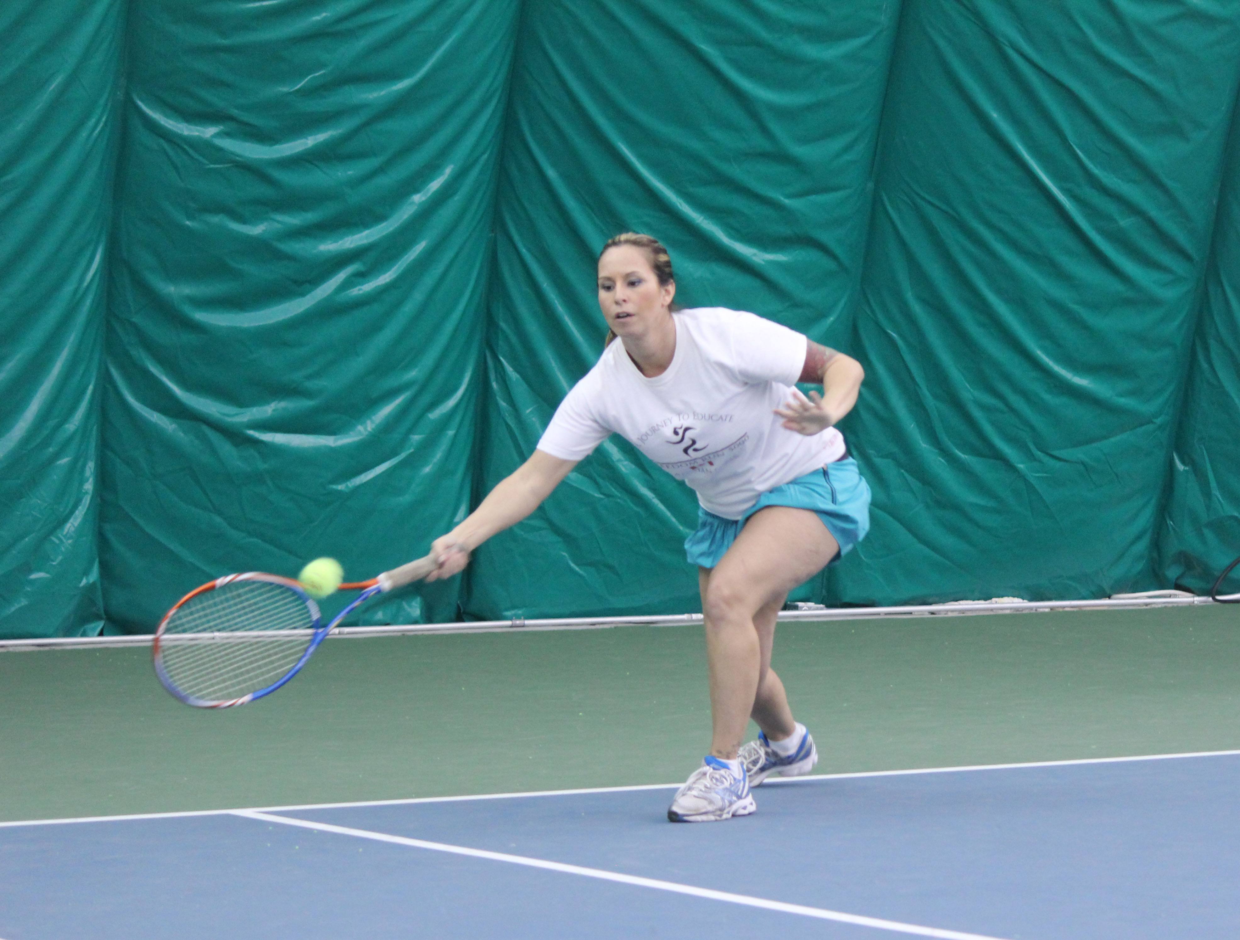 CHALLENGE- Kelly Hornung plays in a mixed doubles tournament at the Red Deer Tennis Club’s indoor dome.