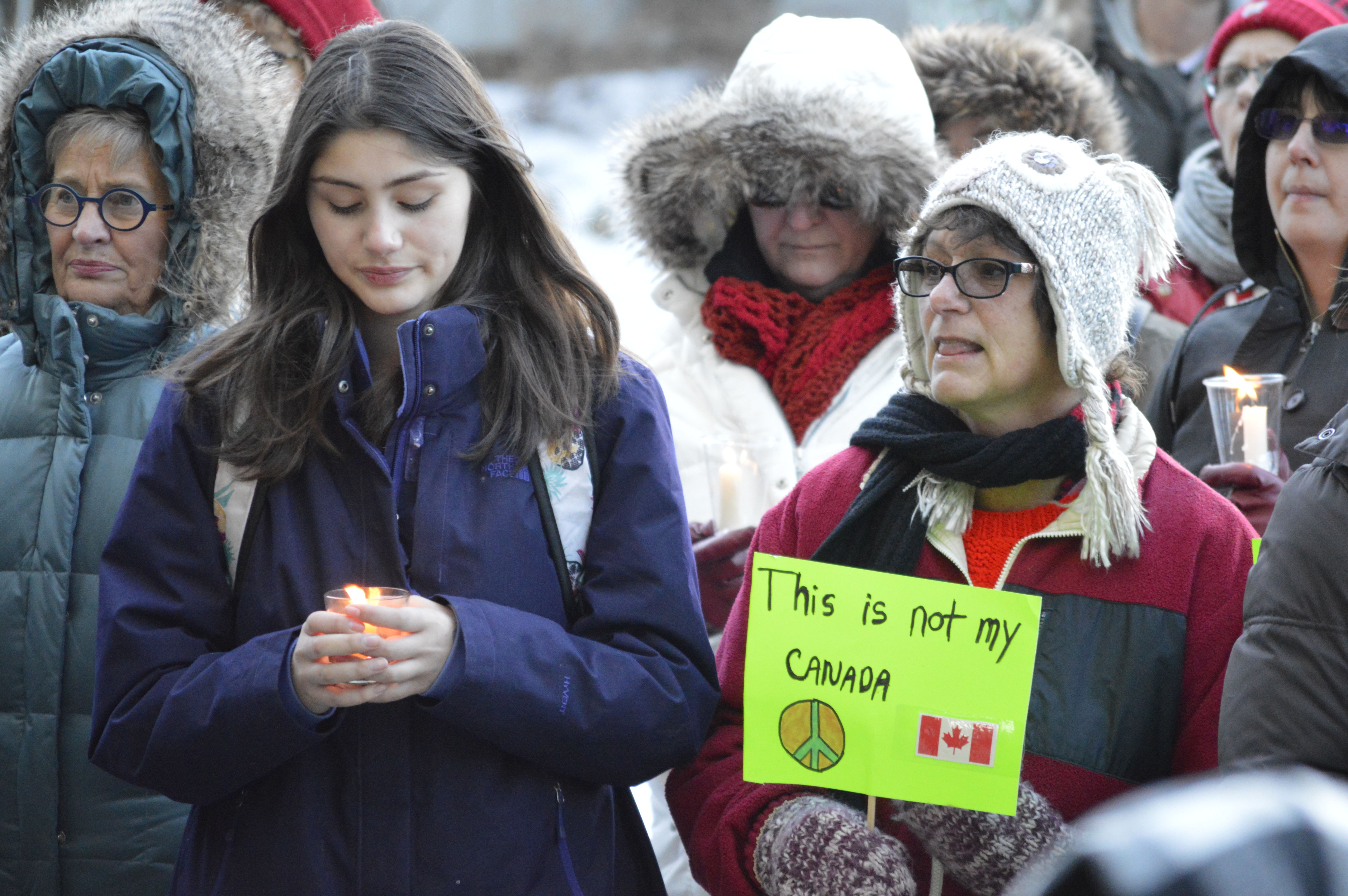 SHOWING SUPPORT - About 100 of people gathered at City Hall Park on Wednesday evening for a candlelight vigil in honour of the victims of the mosque shooting in Sainte-Foy