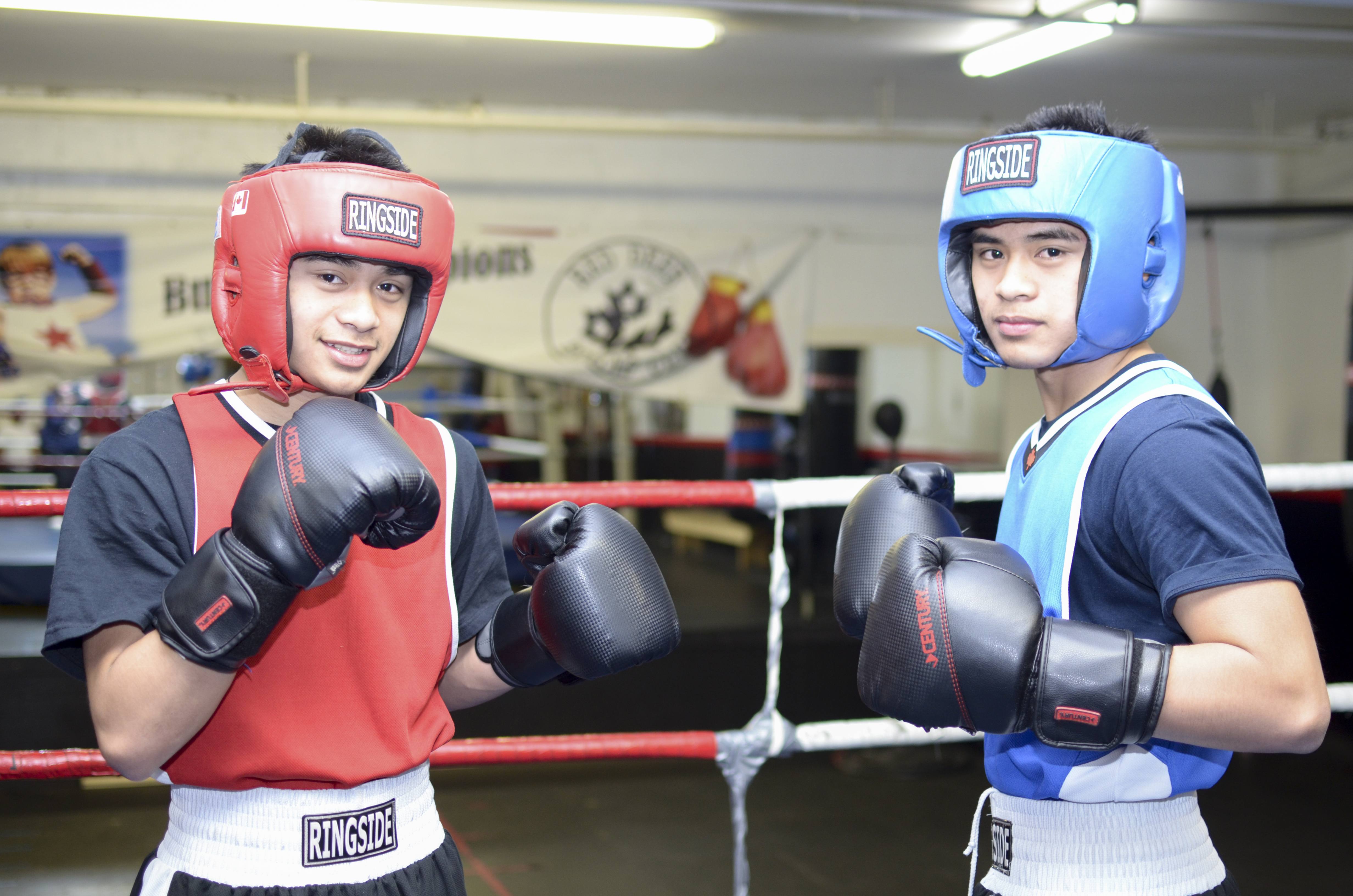 READY TO RUMBLE – Lester and Lowie Cudillo prepare to spar during a recent practice at their home ring at the Red Deer & District Boxing Club. The twin brothers will be defending their provincial championship titles on April 12th and 13th in Red Deer.