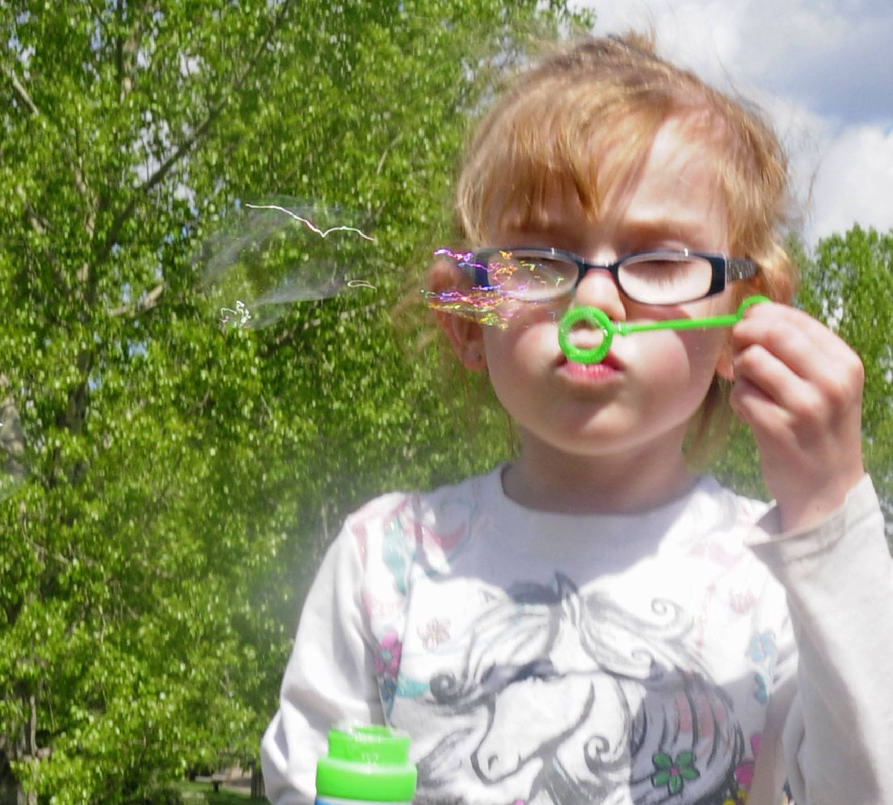 Cara-lyn Derrick blows a bunch of bubbles at Bower Ponds recently during an outing with her family.