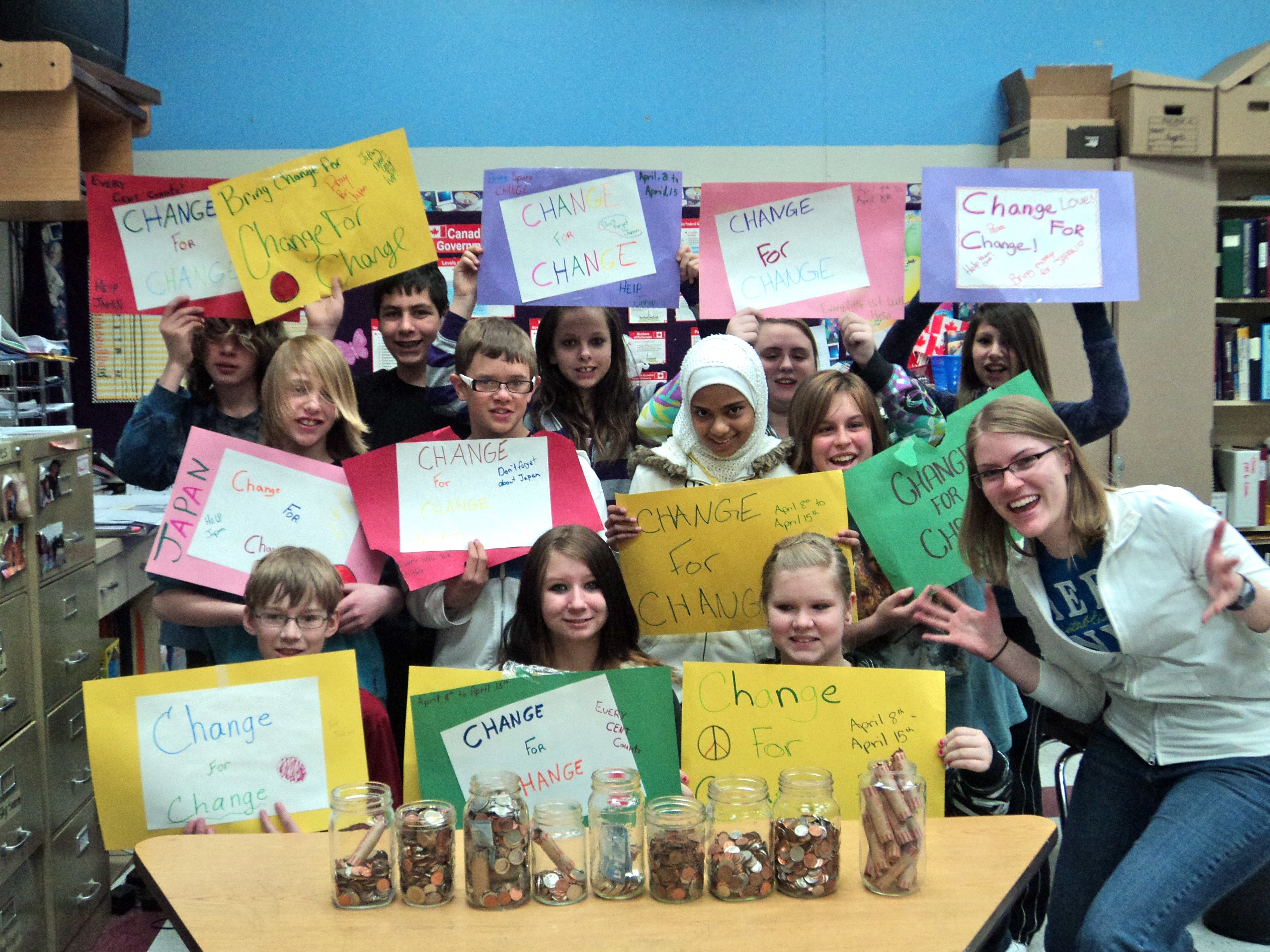 CELEBRATING CHANGE- The Grade 7B students at Glendale Middle School celebrate the amount of change collected after a week of fundraising for Japan relief efforts.