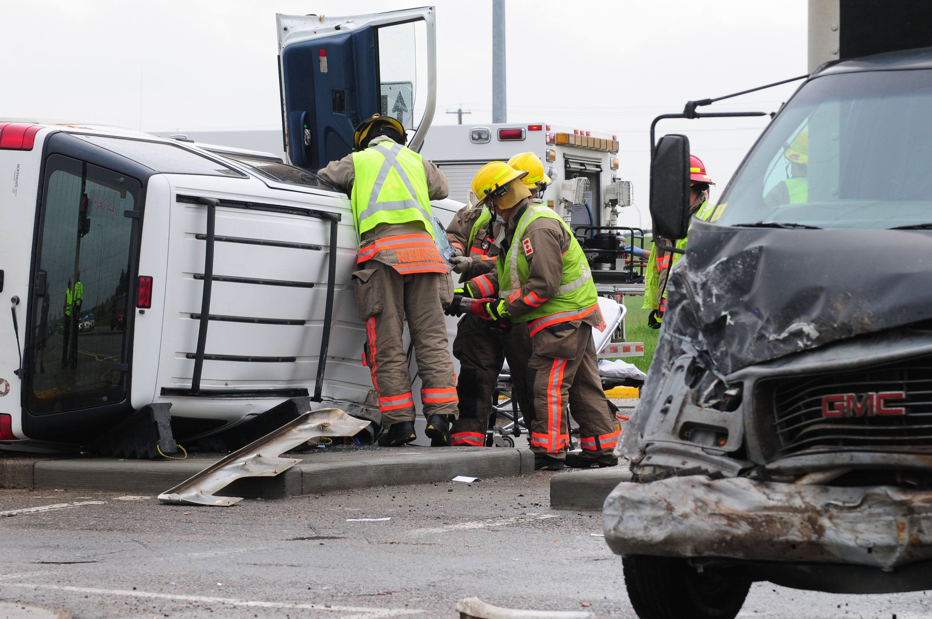 WRECKAGE- Red Deer City Emergency Services Crews work on rescuing a woman from the wreckage after an afternoon collision at the intersection of 19 St. and Taylor Dr. The woman had minor injuries and was treated on scene.