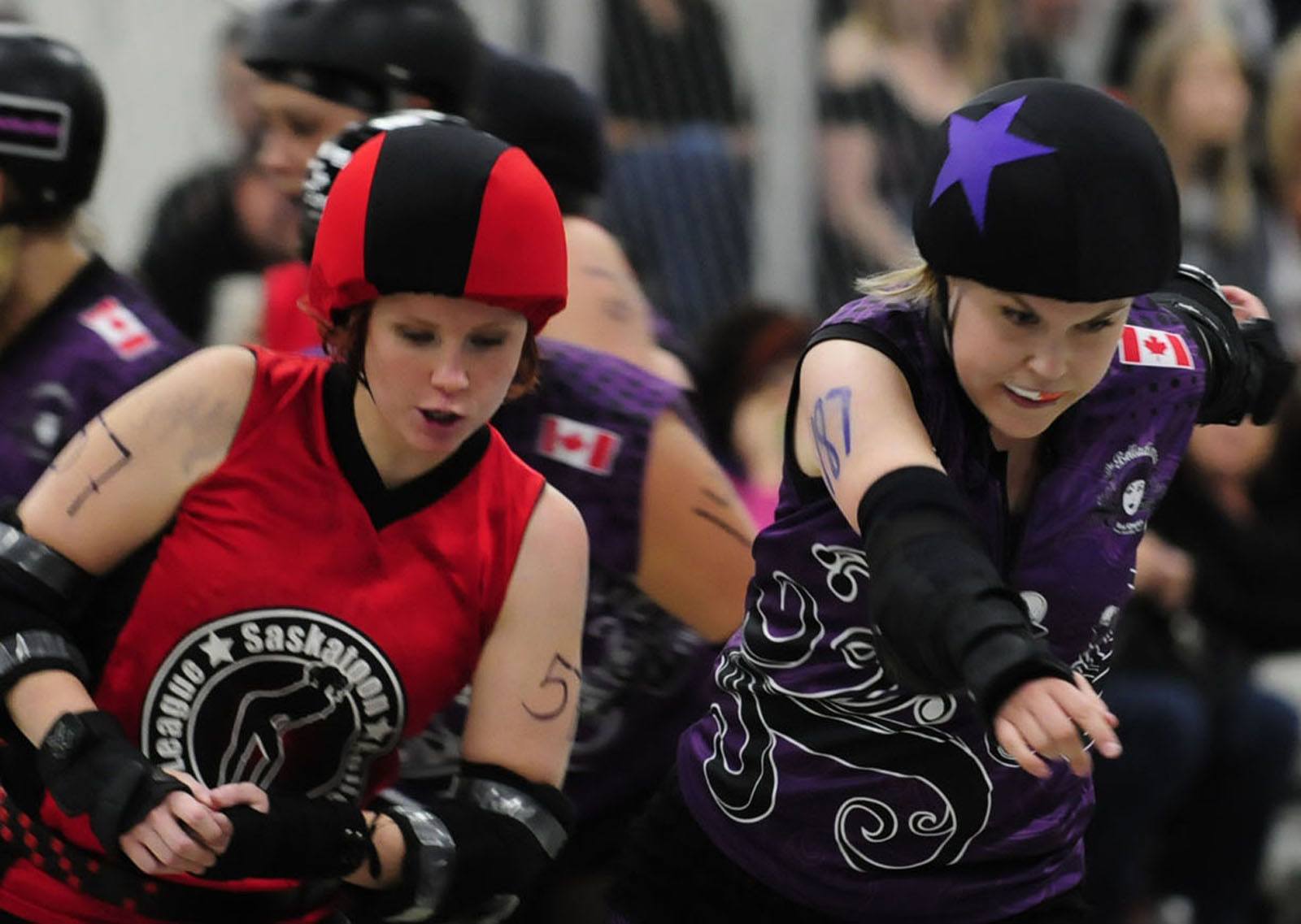 Red Deer Belladonna Hollywood Homicide skates past Dirty Devil of the Saskatoon Roller Derby League during the Summer Grudgen bout Saturday evening at the Westerner. The Belladonnas came out victorious with a final score of 233 to 72.