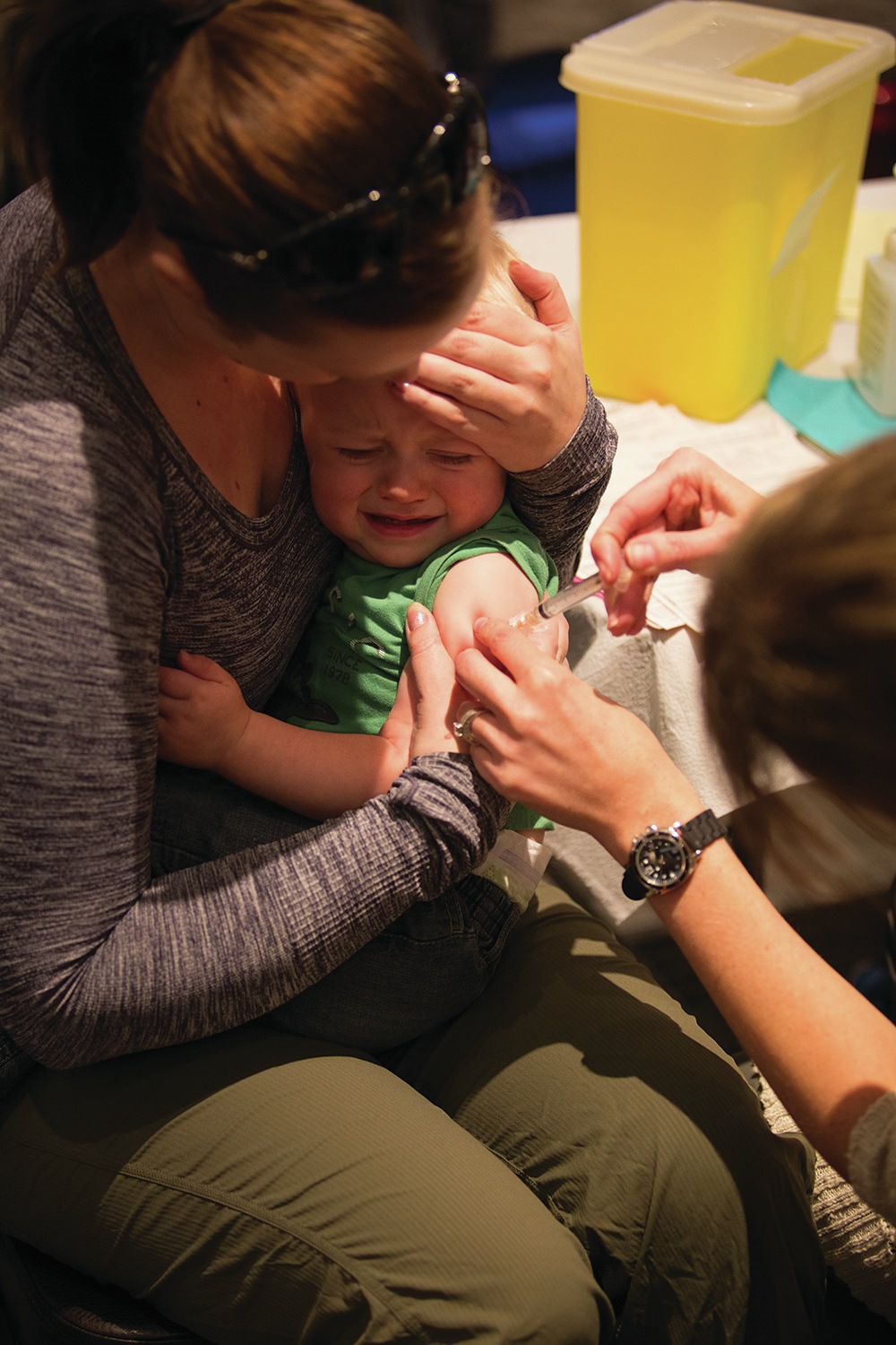 FLU SEASON - Mason Hettesheimer received his flu shot while his mom