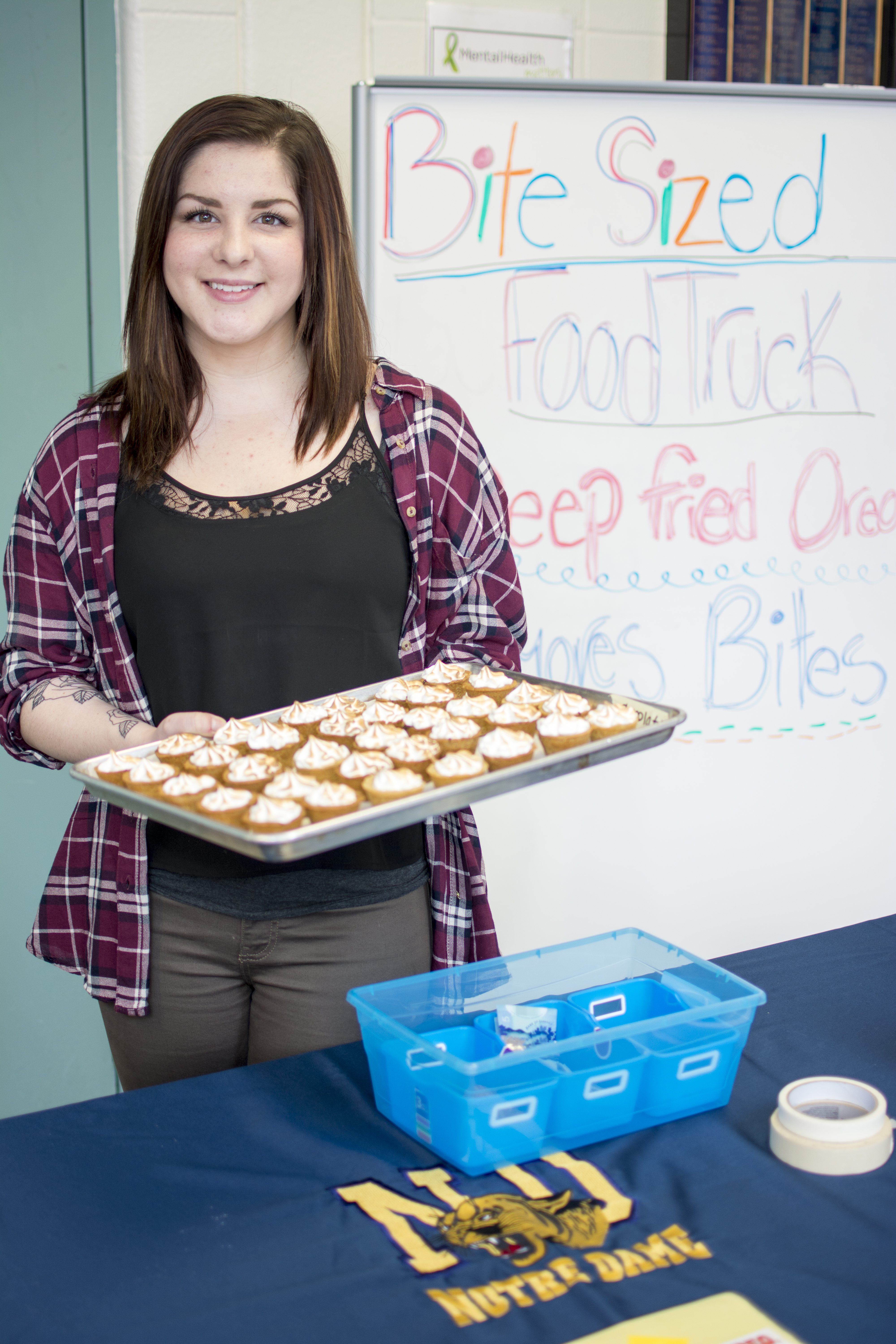 GIVING BACK - Ecole Secondaire Notre Dame Grade 12 student Kalle Price showcases the tasty treats she had for sale during the Food Truck Wars competition