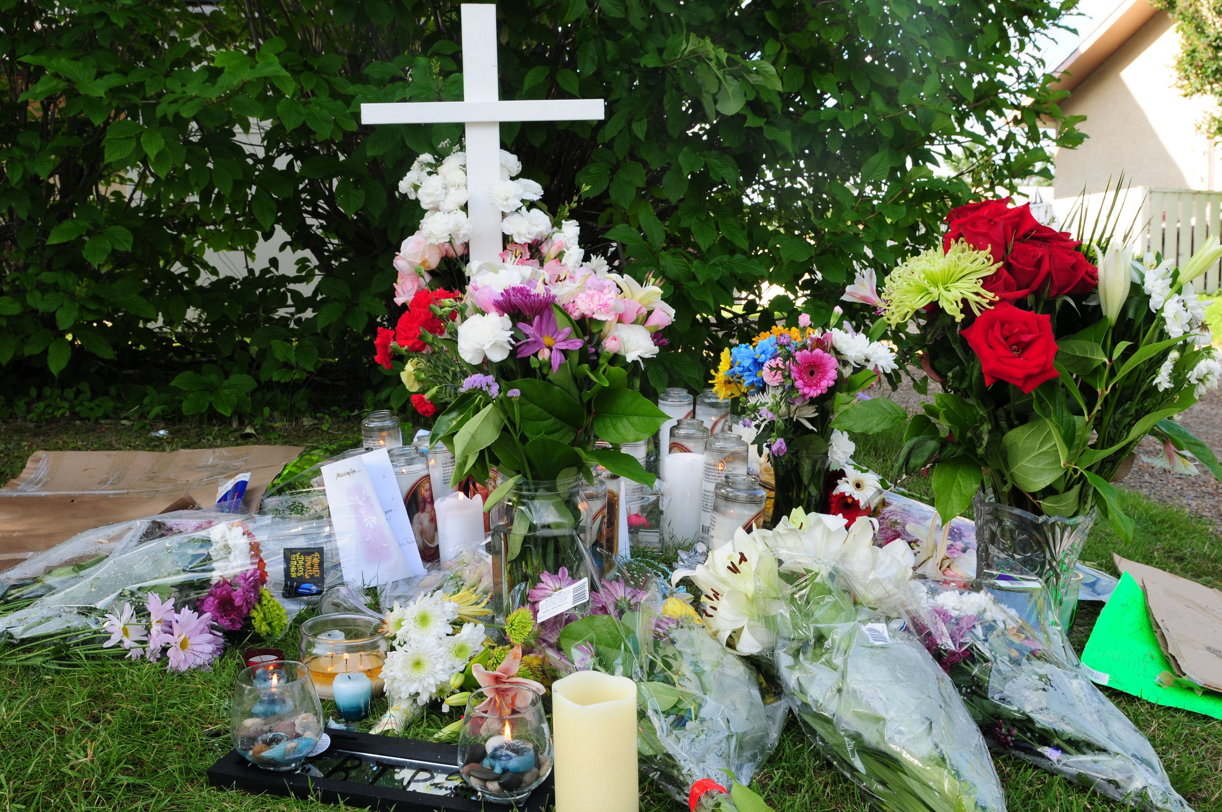 TRAGIC DEATH- Dozens of flowers have been left at the site where 22- year-old Oscar Salazar of Red Deer was shot and killed while in a vehicle early Tuesday evening. On Aug. 2 at 7:05 p.m. RCMP were called after reported shots were fired in the back alley of 63 St. behind the Cornerstone Gospel Chapel. Salazar was pronounced dead on the scene and an 18-year-old male who was also in the vehicle was taken to hospital. No arrests have been made and RCMP continue to investigate.