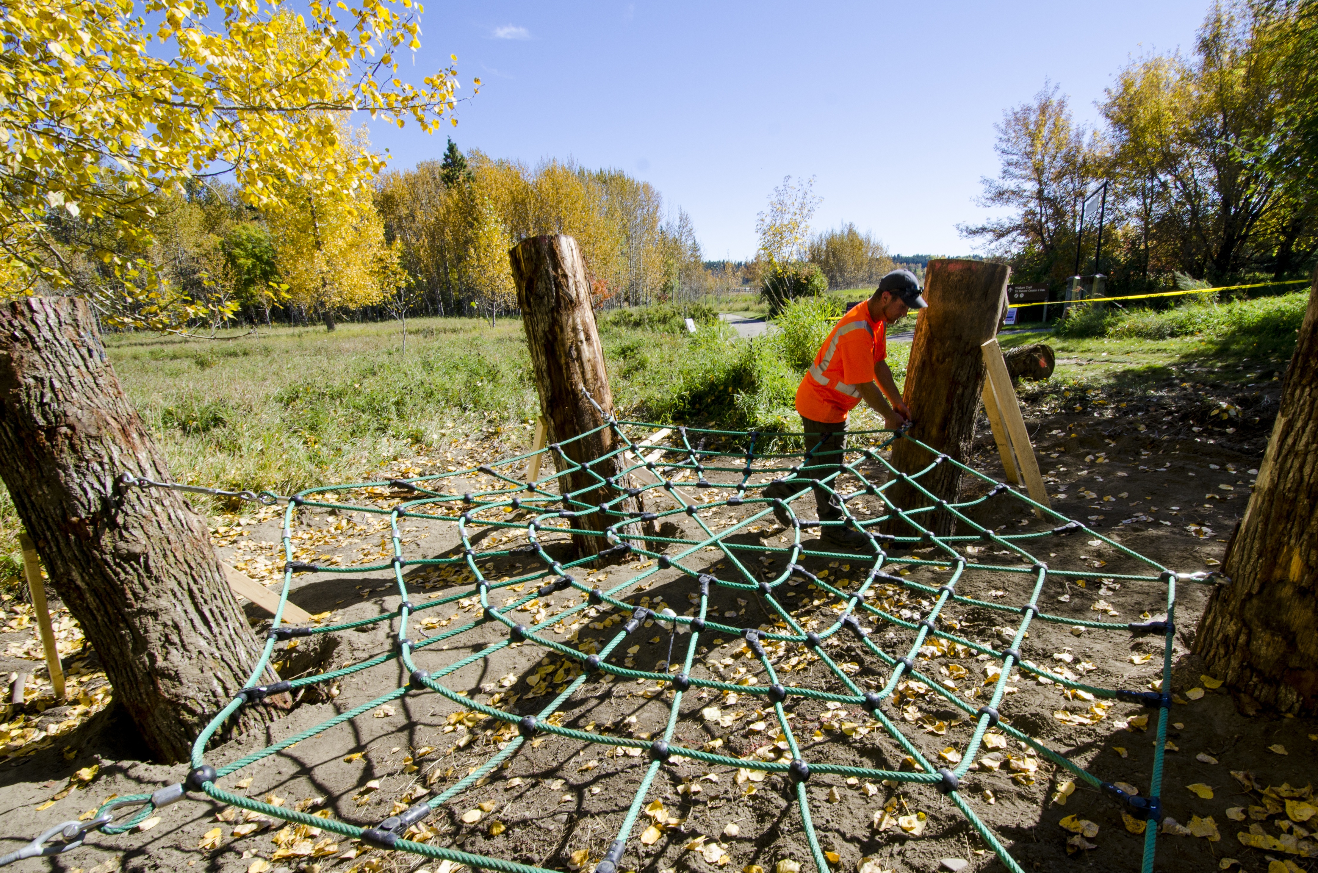 PLAYFUL INSTALLATION – Jay Wood of Bienenstock Nature Playgrounds puts the finishing touches on the spider crawler